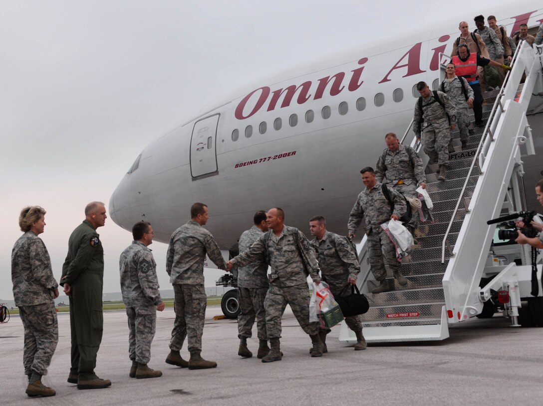 Base leaders greet Ellsworth Airmen upon their return from deployment at Ellsworth Air Force Base, S.D., Aug. 10, 2014. More than 350 Airmen returned from Southwest Asia where they served in support of Operation Enduring Freedom. (U.S. Air Force photo by Senior Airman Zachary Hada/Released)