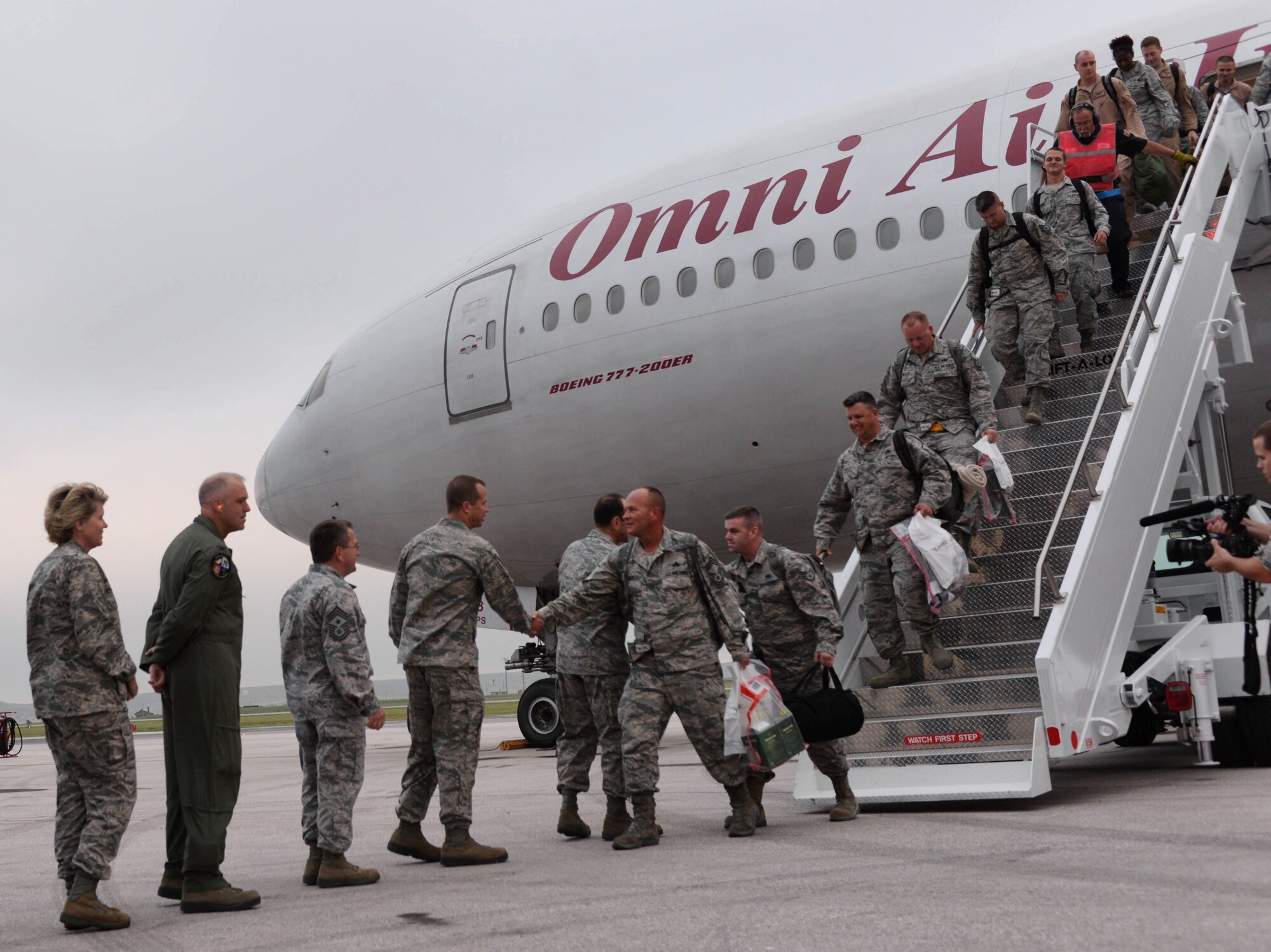 Base leaders greet Ellsworth Airmen upon their return from deployment at Ellsworth Air Force Base, S.D., Aug. 10, 2014. More than 350 Airmen returned from Southwest Asia where they served in support of Operation Enduring Freedom. (U.S. Air Force photo by Senior Airman Zachary Hada/Released)