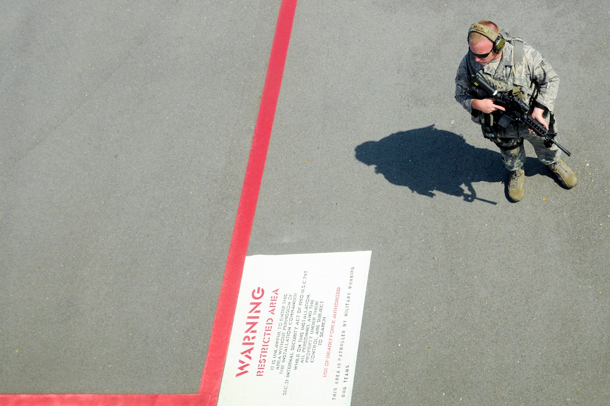 Senior Airman Michael Wrenn, 916th Security Forces Squadron, Seymour Johnson Air Force Base, North Carolina, stands guard during Exercise Razor Sharp, June 2014. (USAF photo by TSgt. Scotty Sweatt, 916ARW/PA)