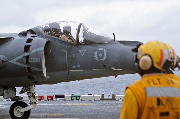 A Marine Aviator in an AV-8B Harrier Jump Jet from Marine Medium Tiltrotor Squadron 365 (Reinforced), 24th Marine Expeditionary Unit, waits for the signal to take off from the USS Iwo Jima off the coast of North Carolina, Aug. 9, 2014. The 24th MEU is taking part in Amphibious Squadron/Marine Expeditionary Unit Integration, or PMINT, the 24th MEU’s second major pre-deployment training exercise. PMINT is designed to bring Marines and Sailors from the 24th MEU and Amphibious Squadron 8 together for the first time aboard the ships of the Iwo Jima Amphibious Ready Group. (U.S. Marine Corps photo by Sgt. Devin Nichols)