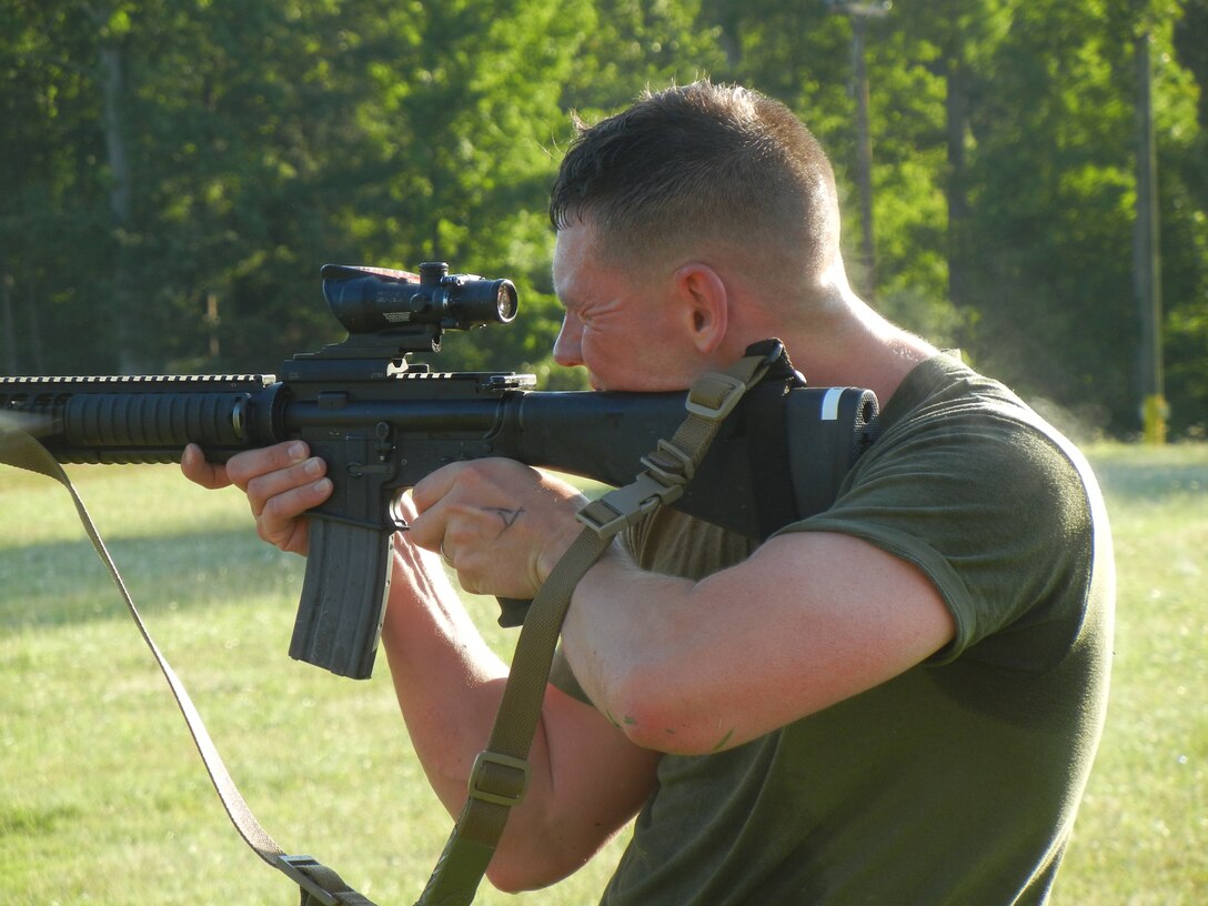 Marines from The Basic School, above, take aim down range while standing during the 2nd Annual Montford Point Biathlon on July 25.