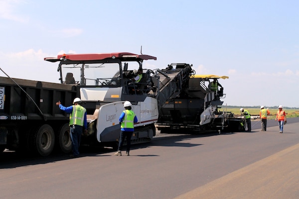 The Vogele Super 1900-2 tracked paver being used by the Minot Air Force Base runway replacement asphalt subcontractor, Lagan, is a piece of equipment not commonly used in the central United States. The paver can set the base course, bring it to elevation, achieve up to 94 percent compaction and be used the next day to place asphalt. It is also capable of roller compacted concrete placement.