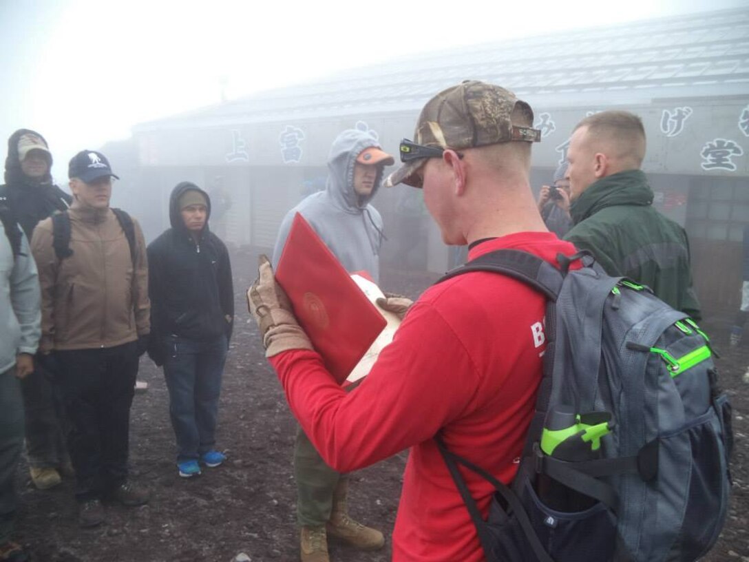 Camp Fuji Marines conduct a reenlistment ceremony atop Mount Fuji on Saturday, August 9.
