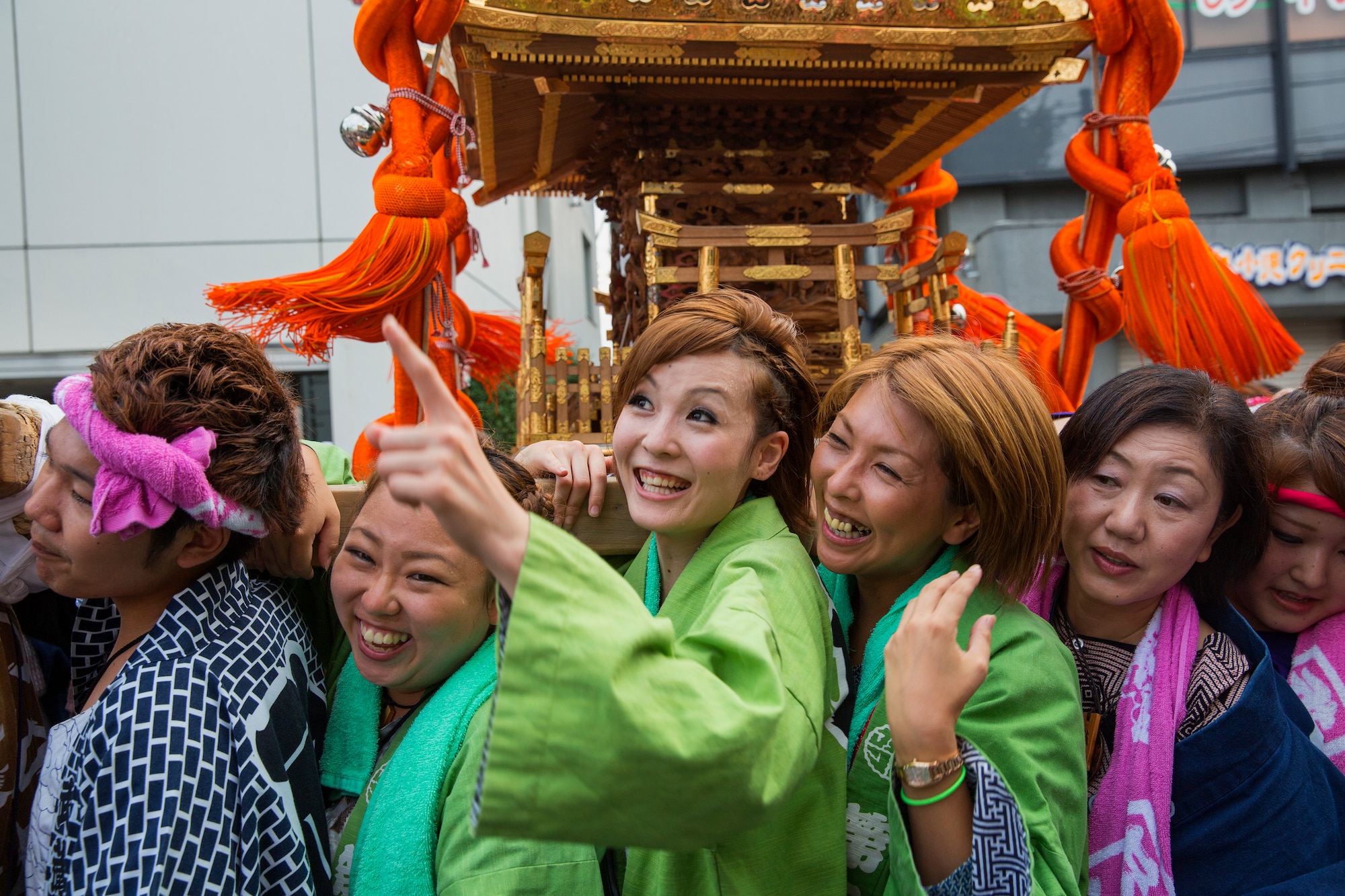 Mikoshi shrine carriers hoist their shrine with their kids at Fussa city, Japan, Aug. 8, 2014. Multiple shrines were carried from the Fussa shinmei-sha, shinto shrine, to City Hall during the 64th annual Fussa Tanabata Festival. (U.S. Air Force photo by Osakabe Yasuo/Released)