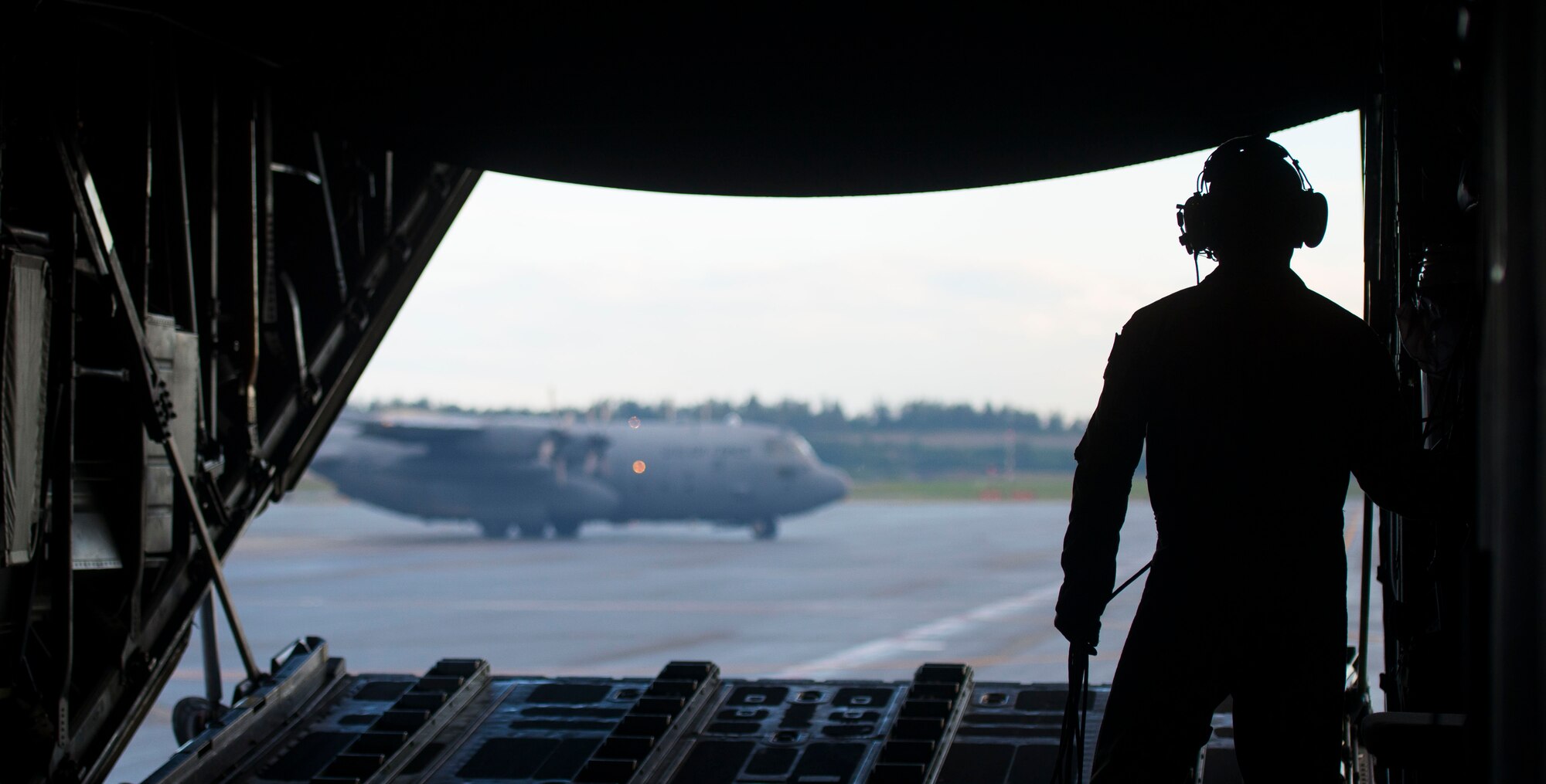 Airman 1st Class David Martinez, 36th Airlift Squadron loadmaster, raises the ramp on a C-130 Hercules during the first day of Exercise Red Flag Aug. 11, 2014, Joint Base Elmendorf-Richardson, Alaska. Red Flag is an exercise that provides joint offensive counter-air, interdiction, close air support, and large force employment training in a simulated combat environment. (U.S. Air Force photo by Staff Sgt. Chad C. Strohmeyer/Released)