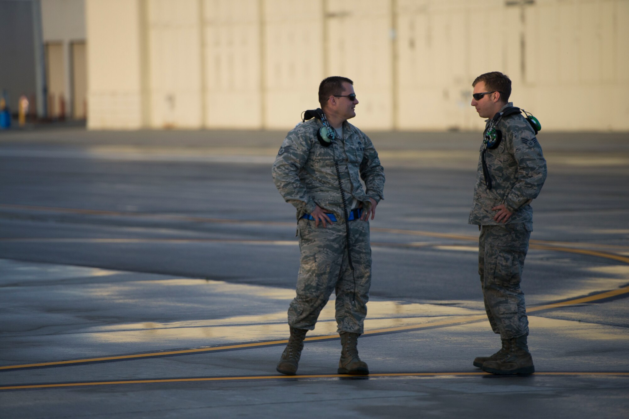 Members from the 374th Maintenance Squadron discuss morning sorties during the first day of Exercise Red Flag Aug. 11, 2014, Joint Base Elmendorf-Richardson, Alaska. The exercise enables all aircrew units to sharpen their combat skills by flying simulated combat sorties in a realistic threat environment. (U.S. Air Force photo by Staff Sgt. Chad C. Strohmeyer/Released)