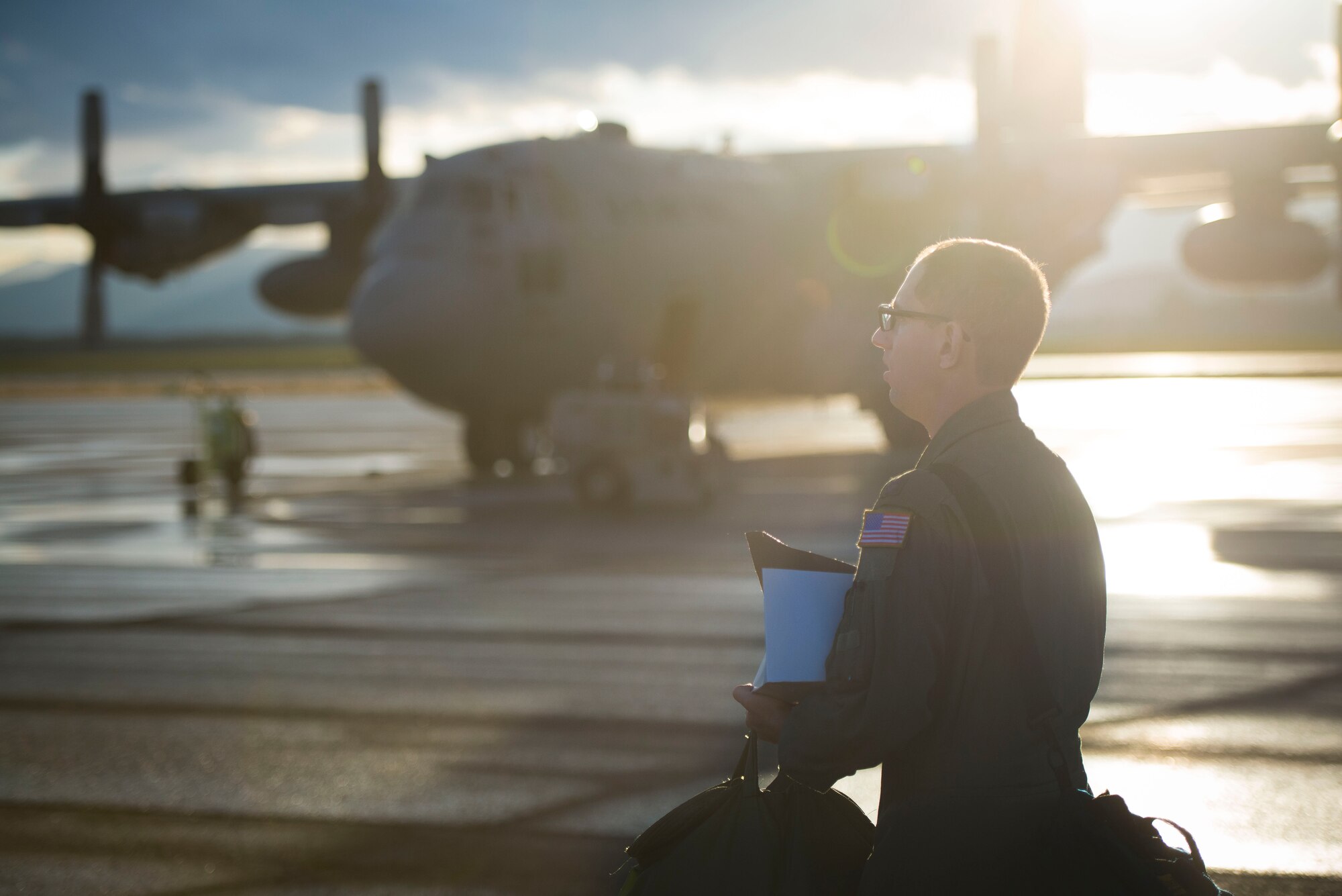 Capt. Mark Nexon, 36th Airlift Squadron pilot, steps to his aircraft during the first day of Exercise Red Flag Aug. 11, 2014, Joint Base Elmendorf-Richardson, Alaska. Red Flag is an exercise that provides joint offensive counter-air, interdiction, close air support, and large force employment training in a simulated combat environment. (U.S. Air Force photo by Staff Sgt. Chad C. Strohmeyer/Released)