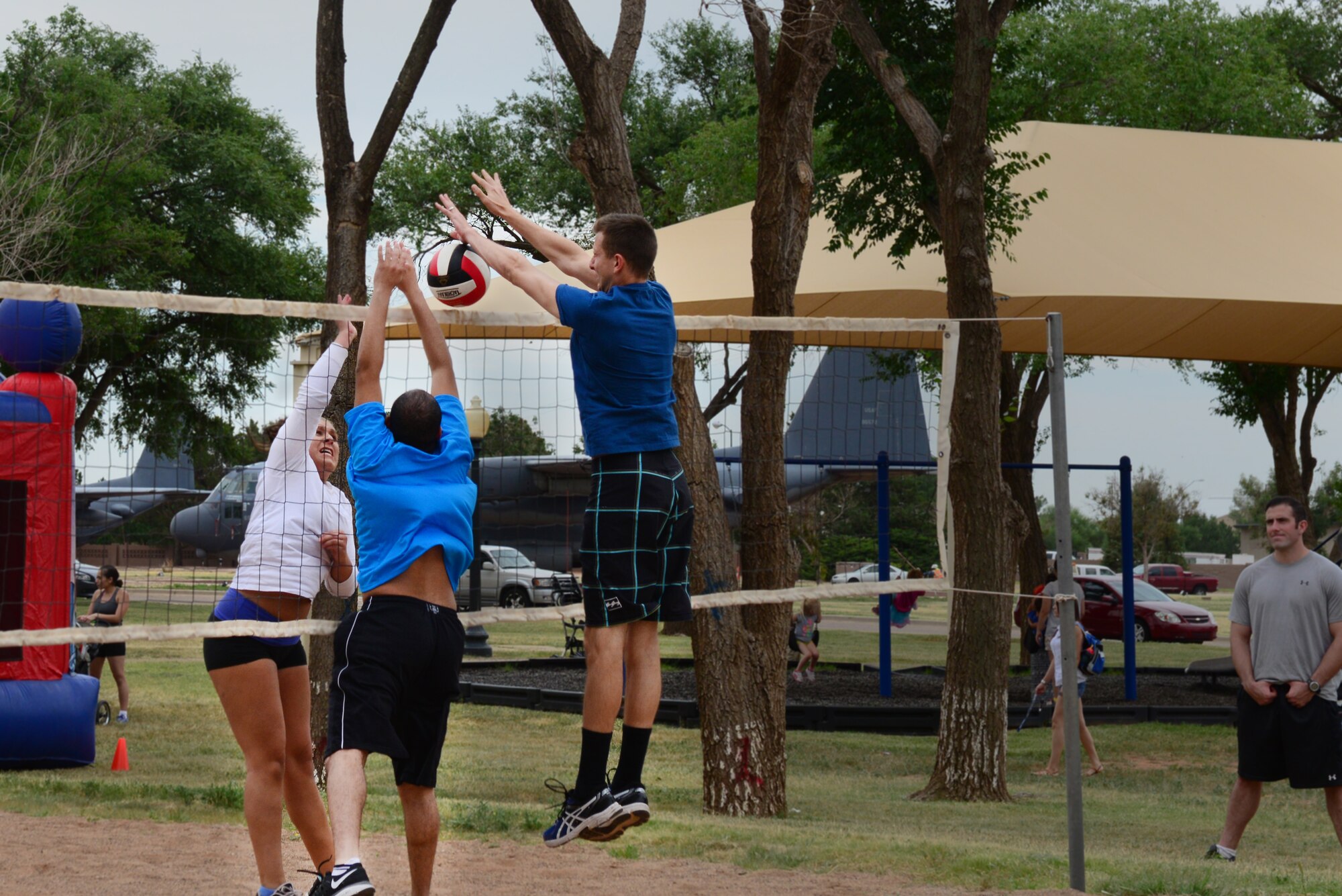 Competition heats up between Airmen from the 27th Special Operations Force Support Squadron and 27th Special Operations Wing Staff Agencies in a volleyball tournament at Cannon Appreciation Day, Aug. 8, 2014 at Cannon Air Force Base, N.M. The event celebrated the strong connection between the base and nearby Clovis, N.M. (U.S. Air Force Photo/Airman 1st Class Shelby Kay-Fantozzi) 