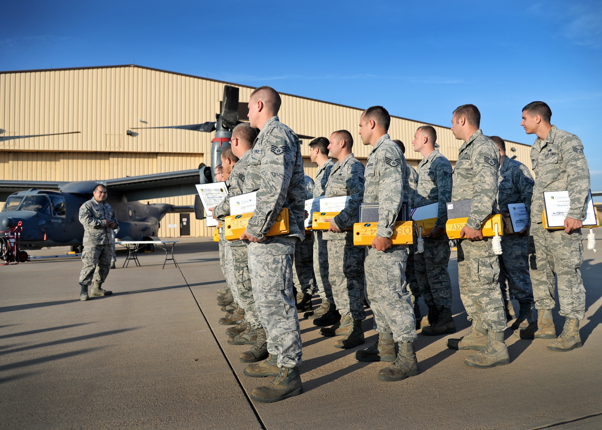 U.S. Air Force Senior Master Sgt. Jesse Meno, 20th Aircraft Maintenance Unit maintenance supervisor, addresses newly appointed dedicated crew chiefs on Aug. 4, 2014 at Cannon Air Force Base, N.M. Meno encouraged the Airmen to own every single process of their new responsibility. (U.S. Air Force Photo/Airman 1st Class Chip Slack)