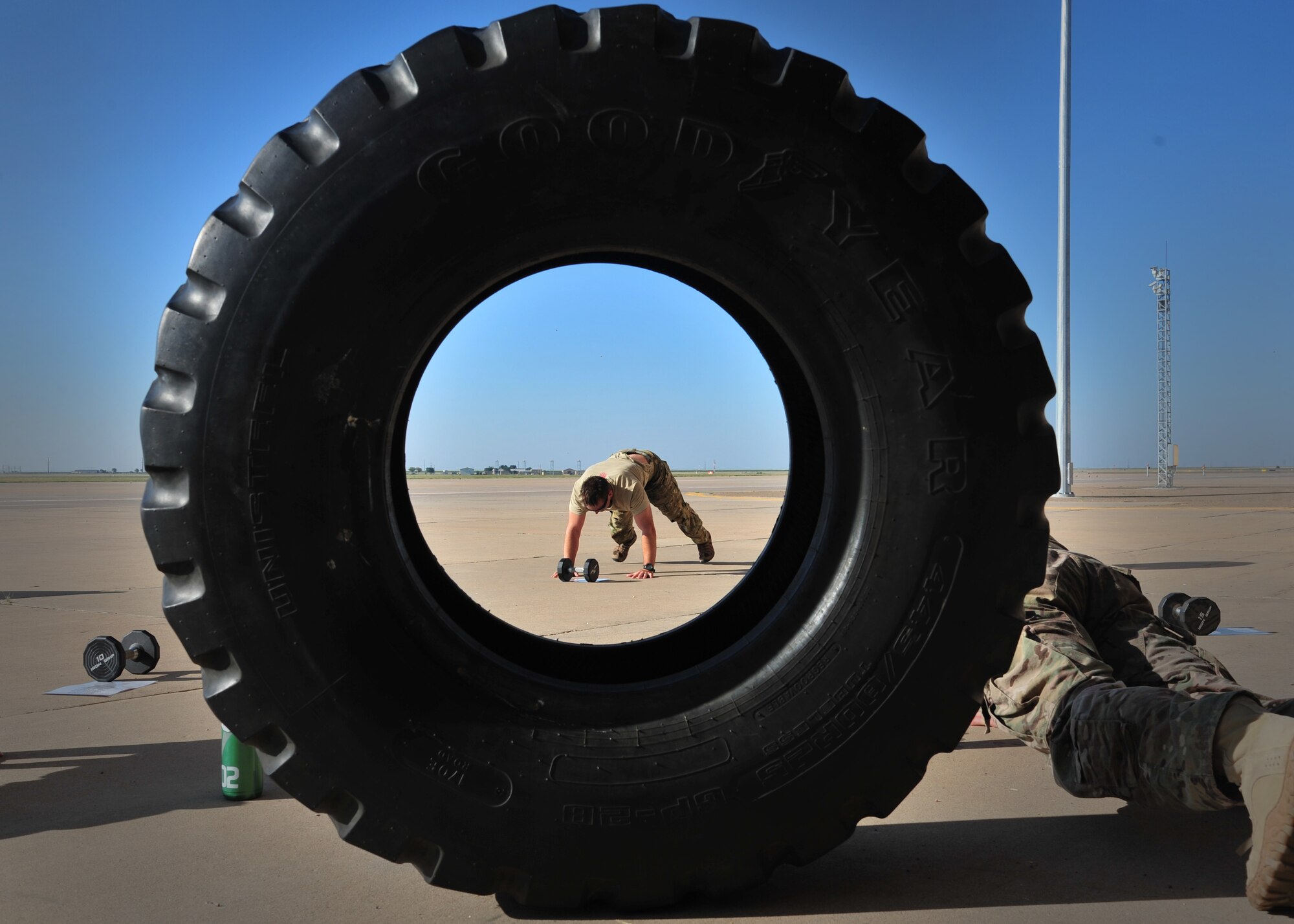 Members from 26th Special Tactics Squadron endure the final physical component of a Monster Mash Aug. 6, 2014 at Cannon Air Force Base, N.M. The Air Commandos were memorializing the sacrifices of those who lost their lives aboard Extortion 17. (U.S. Air Force photo/Staff Sgt. Alexxis Pons Abascal)
