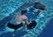 Members from 26th Special Tactics Squadron race full-speed with weights under water during the relay component of a Monster Mash Aug. 6, 2014 at Cannon Air Force Base, N.M. The Air Commandos were memorializing the sacrifices of those who lost their lives aboard Extortion 17. (U.S. Air Force photo/Staff Sgt. Alexxis Pons Abascal)
  