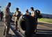 Members from 26th Special Tactics Squadron gather up to coordinate movement of an over-sized tire during a Monster Mash Aug. 6, 2014 at Cannon Air Force Base, N.M. The Air Commandos were memorializing the sacrifices of those who lost their lives aboard Extortion 17. (U.S. Air Force photo/Staff Sgt. Alexxis Pons Abascal)