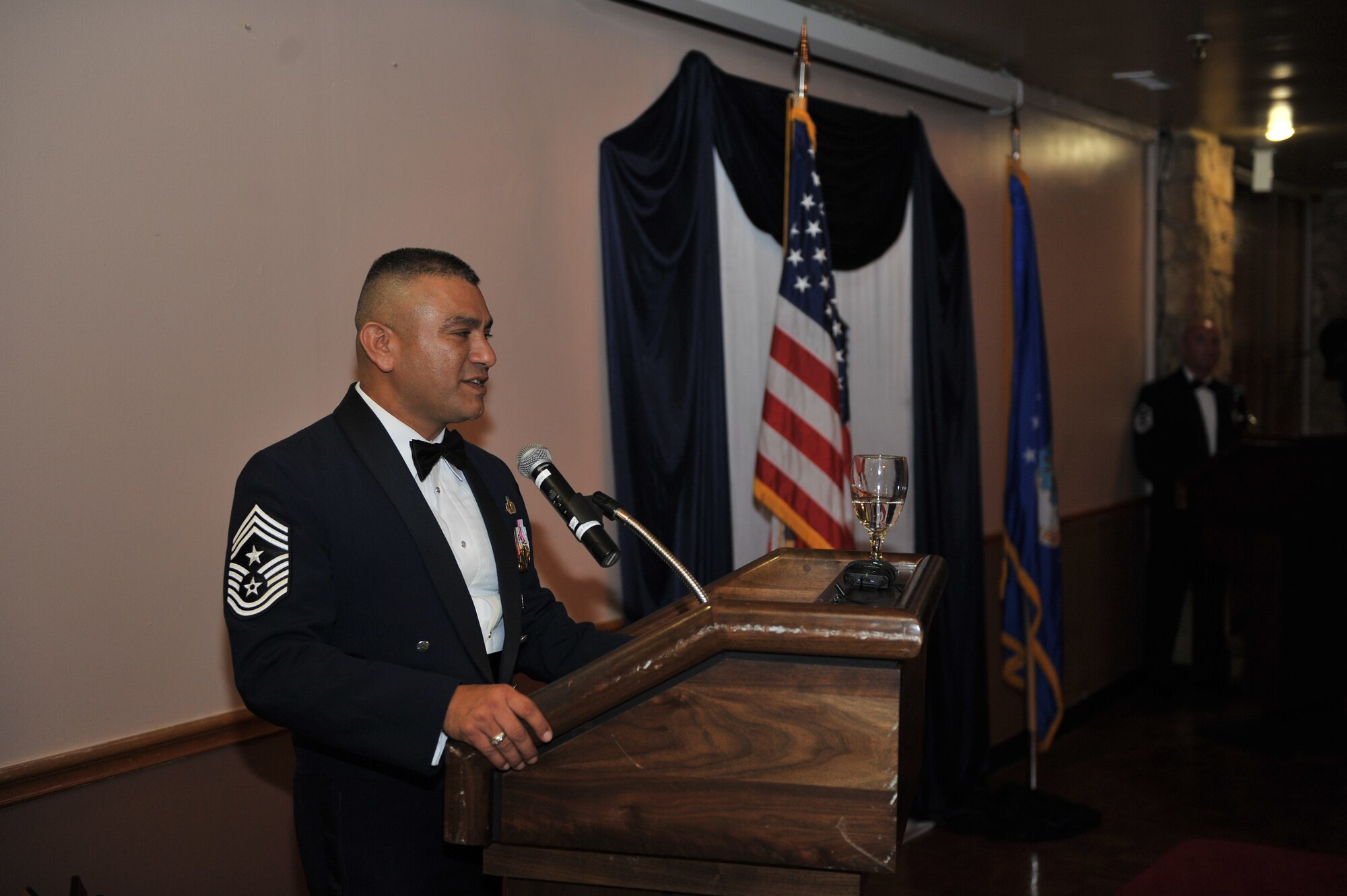 ALTUS AIR FORCE BASE, Okla. – U.S. Air Force Chief Master Sgt. Gerardo Tapia, command chief of Air Education and Training Command, speaks to Airmen during the Senior NCO Induction Ceremony inside Club Altus Aug. 8, 2014. The ceremony was held to honor Altus AFB’s future Master Sergeants and formally recognize them for their accomplishment of joining the top enlisted tier of the Air Force. (U.S. Air Force photo by Senior Airman Dillon Davis/Released)