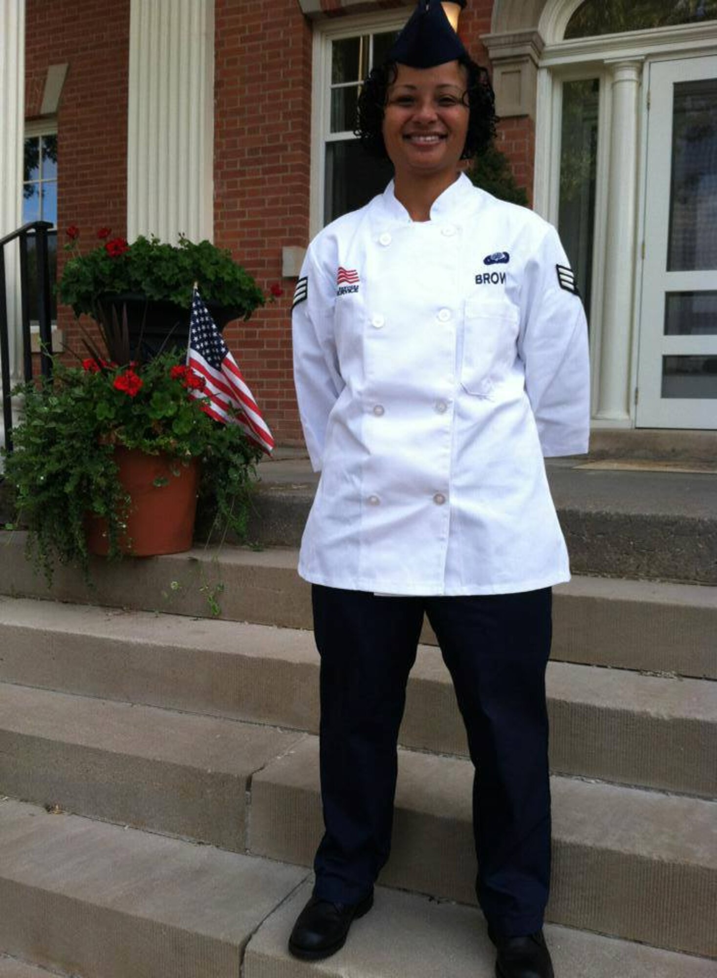Senior Airman Lisa Brown, 446th Force Support Squadron sustainment services specialist, poses for a photo wearing her services uniform. Brown recently joined the 446th Airlift Wing after serving active duty for four and a half years. (Photo courtesy of Senior Airman Lisa Brown)