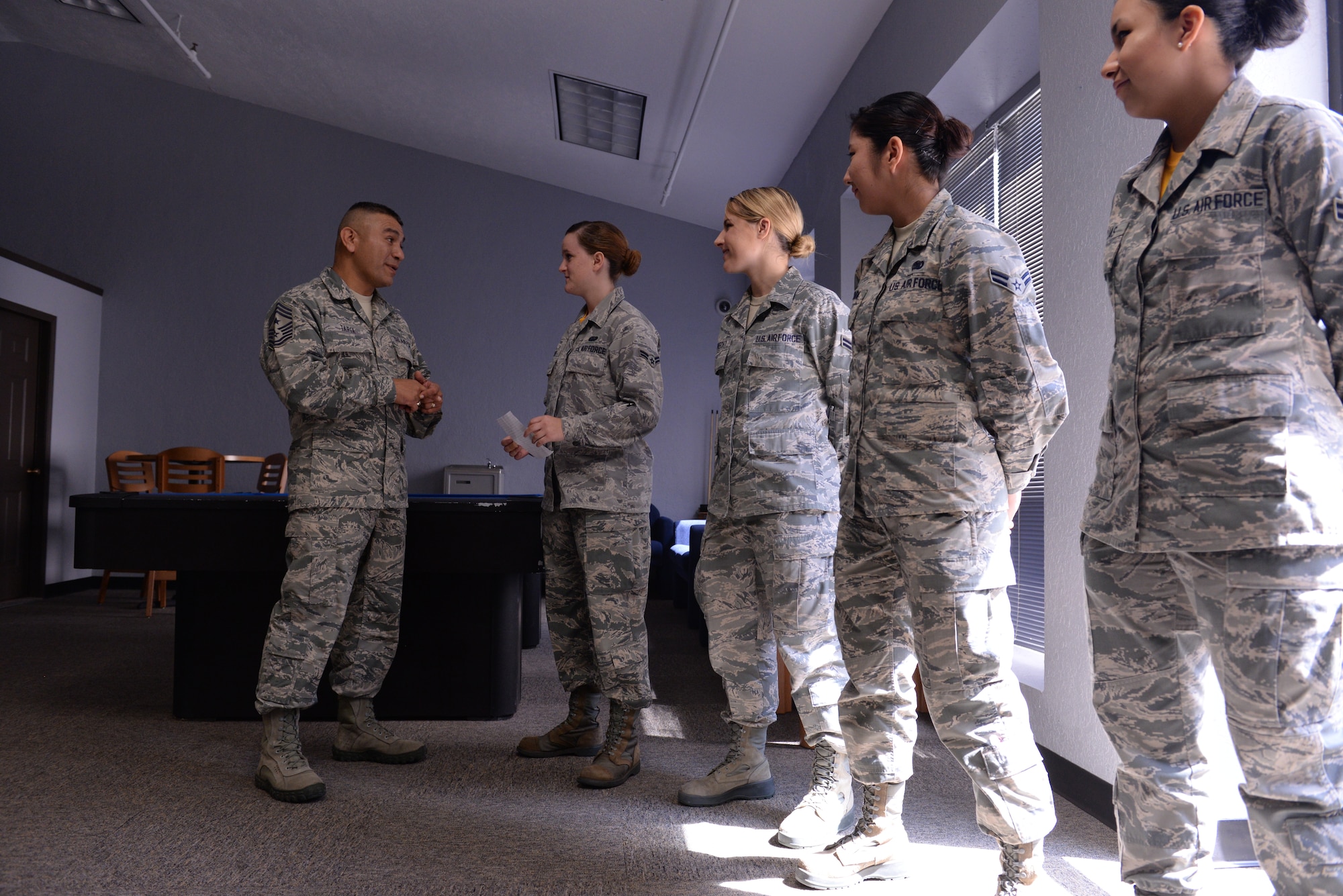 ALTUS AIR FORCE BASE, Okla. – U.S. Air Force Chief Master Sgt. Gerardo Tapia, command chief of Air Education and Training Command, speaks with Airmen of the dorm council during his visit to the 97th Air Mobility Wing Aug. 8, 2014. Tapia discussed quality of life issues with the Airmen and offered advice to get more Airmen involved in the council. (U.S. Air Force photo by Staff Sgt. Nathanael Callon/Released)