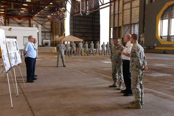ALTUS AIR FORCE BASE, Okla. – Jim Kelly, 97th Air Maintenance Directorate director, explains recent maintenance process improvements his team has developed to U.S. Air Force Chief Master Sgt. Gerardo Tapia, command chief of Air Education and Training Command, during Tapia’s visit to the 97th Air Mobility Wing Aug. 8, 2014. This was Tapia’s first visit to Altus AFB since becoming the AETC command chief. (U.S. Air Force photo by Staff Sgt. Nathanael Callon/Released) 