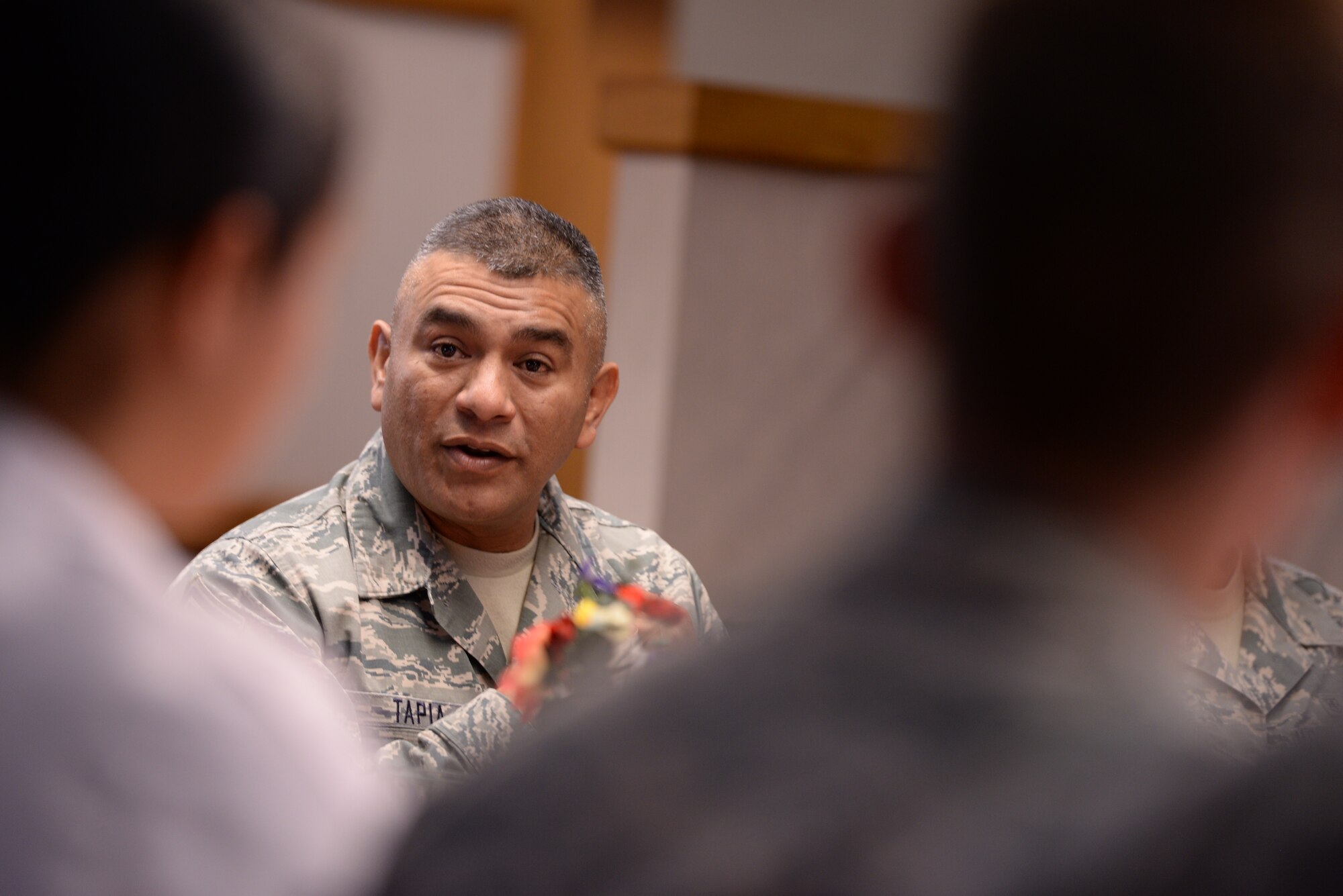 ALTUS AIR FORCE BASE, Okla. – U.S. Air Force Chief Master Sgt. Gerardo Tapia, command chief of Air Education and Training Command, speaks with Airmen from the 97th Air Mobility Wing during breakfast Aug. 8, 2014. Tapia met with Airmen and discussed current Air Force issues including force-shaping, the new enlisted performance system and developmental special duties. (U.S. Air Force photo by Staff Sgt. Nathanael Callon/Released) 