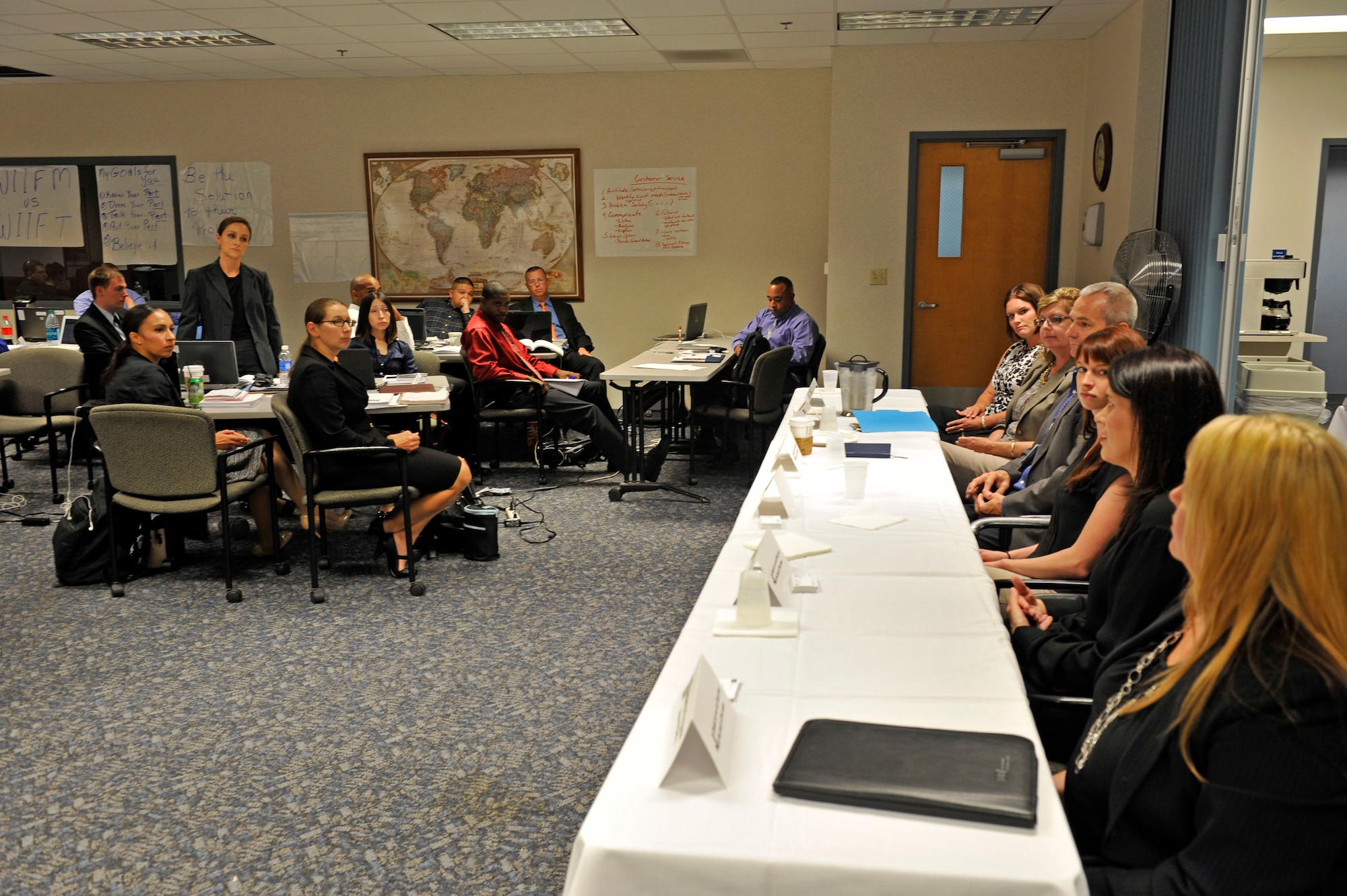 A service member listens to an answer to her question to a panel of employers during a Transition Assistance Program class at Scott Air Force Base, Ill., Aug. 6, 2014. Hosting a panel of local employers is one of the new additions to the class. Scott’s TAP class was visited by a team from the Transition to Veterans Program Office that is working. The classes are held at the Airman and Family Readiness Center. TAP has recently been revamped into a five-day course, including how to prepare for a job in the civilian workplace. (U.S. Air Force photo by Airman 1st Class Erica L. Crossen)