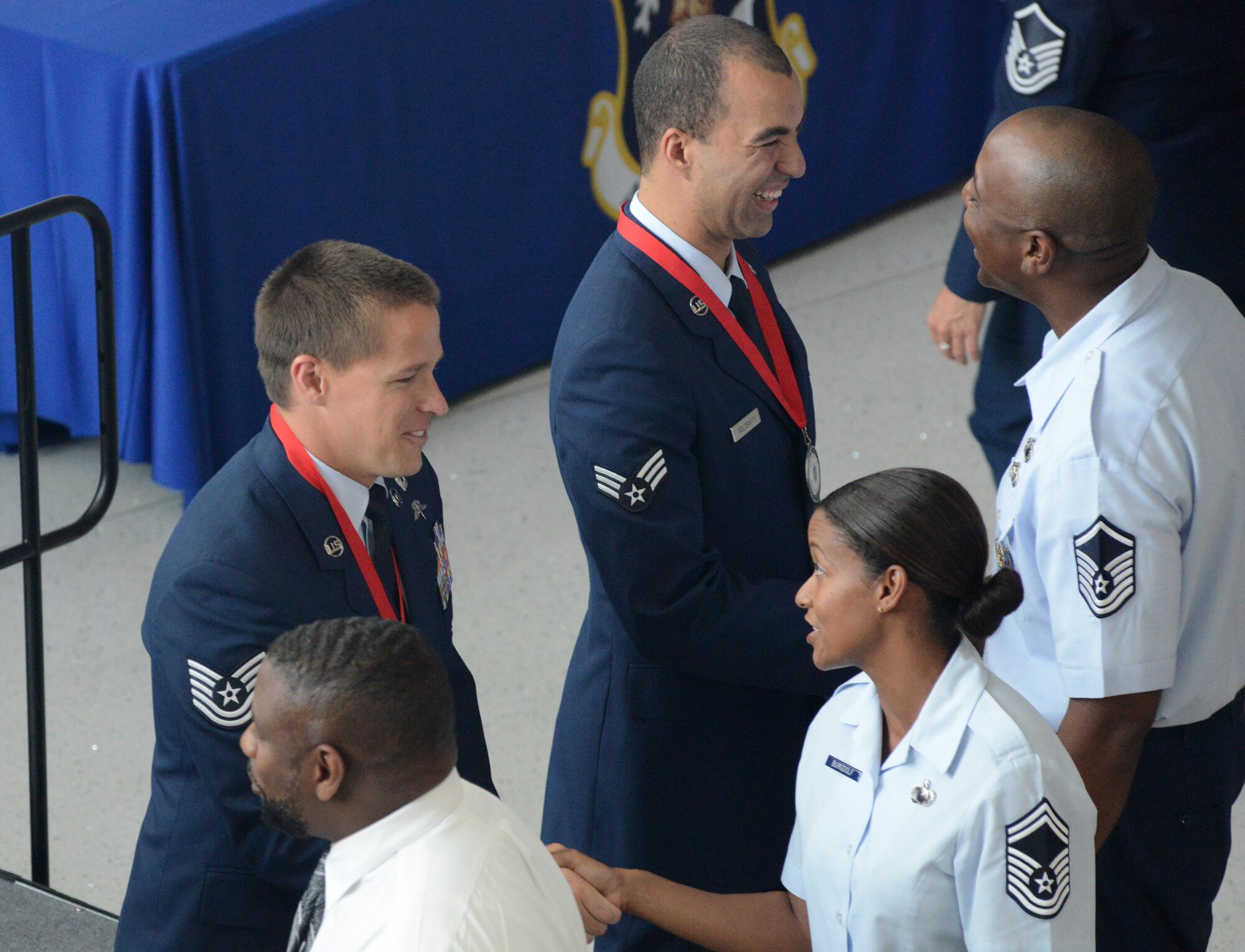 Airmen at the Air National Guard Readiness Center congratulate the ANG's 2014 Outstanding Airmen of the Year during an all call hosted by Lt. Gen. Stanley E. Clarke III, director of the ANG, at the ANGRC on Joint Base Andrews, Maryland, Aug. 7, 2014. The all call was part of Focus on the Force week, a series of events designed to bring the perspective of the enlisted Air Guardsman to ANG leadership, and discuss challenges faced by Airmen across the ANG. (U.S. Air National Guard photo by Senior Airman John E. Hillier/Released)