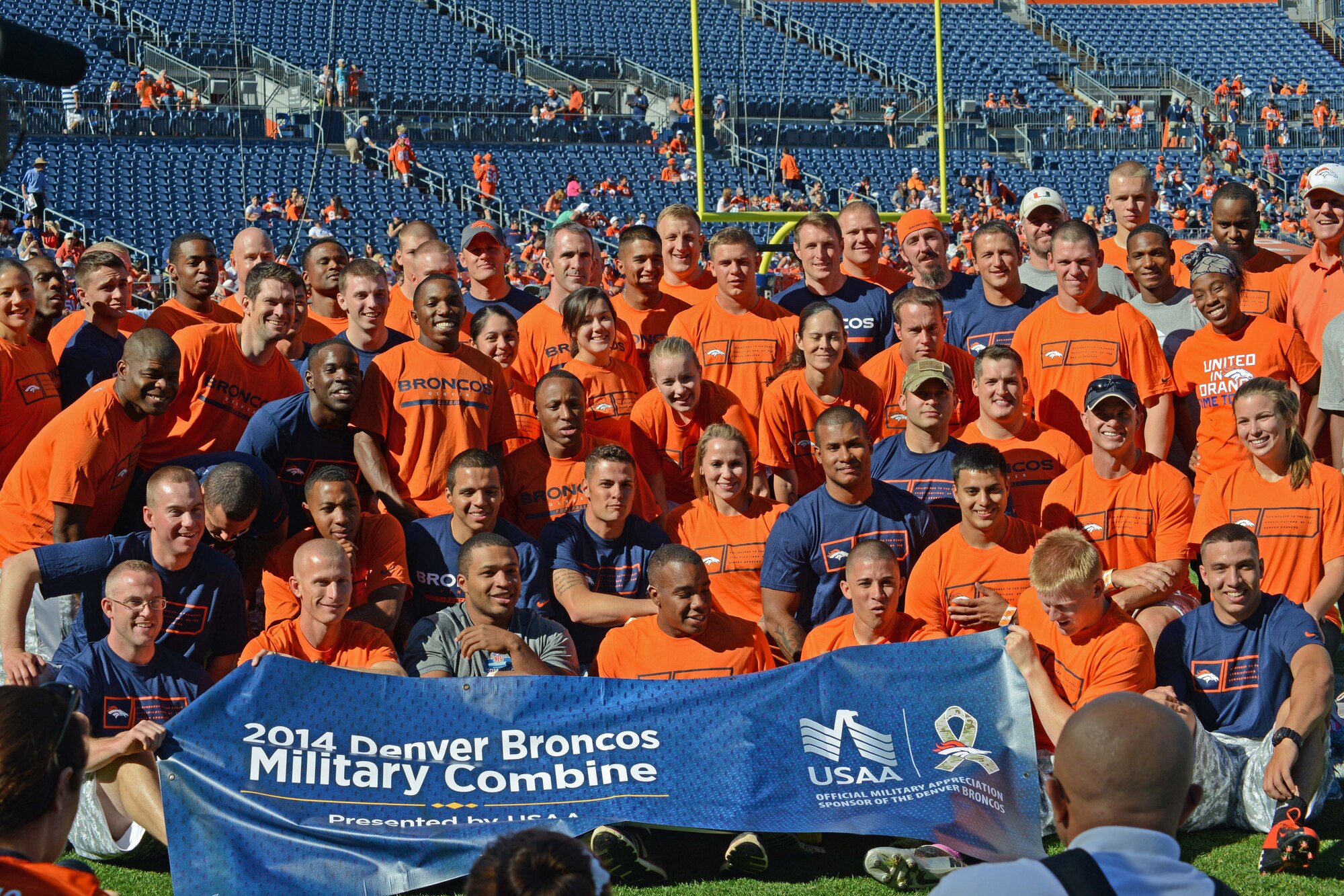DENVER — Service members from Peterson Air Force Base, Schriever Air Force Base, the U.S. Air Force Academy and Fort Carson pose for a photo after competing in the Denver Broncos Combine at Sports Authority Field at Mile High Aug. 2. The event was sponsored by USAA and the Denver Broncos to support and recognize local military members. (U.S. Air Force photo/Airman 1st Class Rose Gudex)