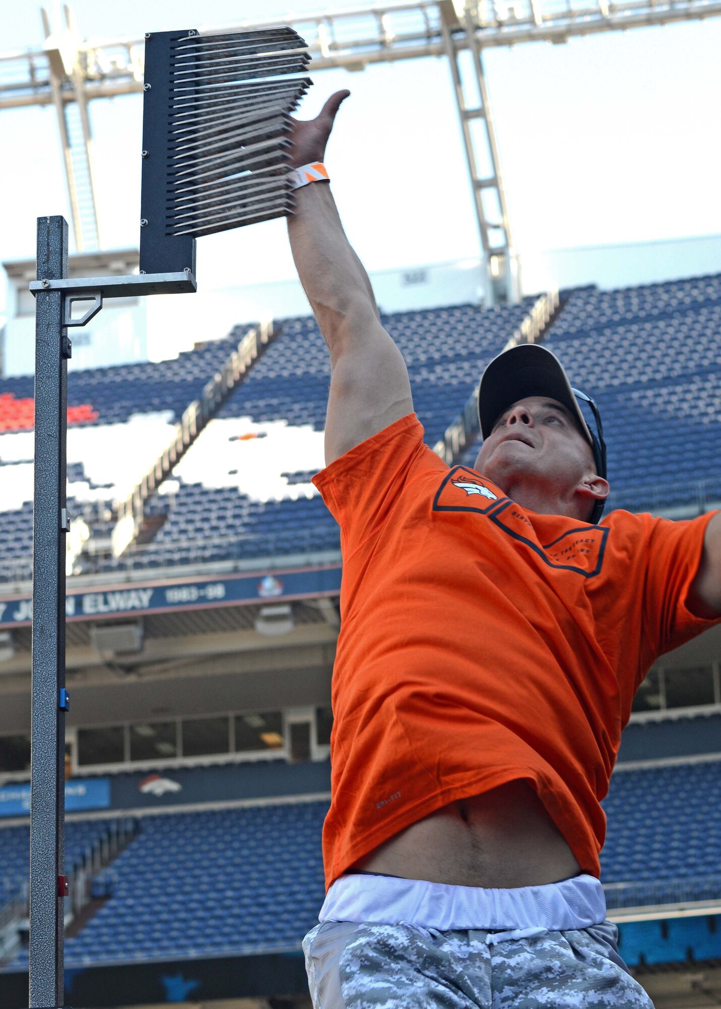 DENVER —Staff Sgt. Jeremiah Sell, 4th Space Control Squadron, tests his vertical jump at the Denver Broncos Combine at Sports Authority Field at Mile High Aug. 2. The event was sponsored by USAA and the Denver Broncos to support and recognize local military members. (U.S. Air Force photo/Airman 1st Class Rose Gudex)