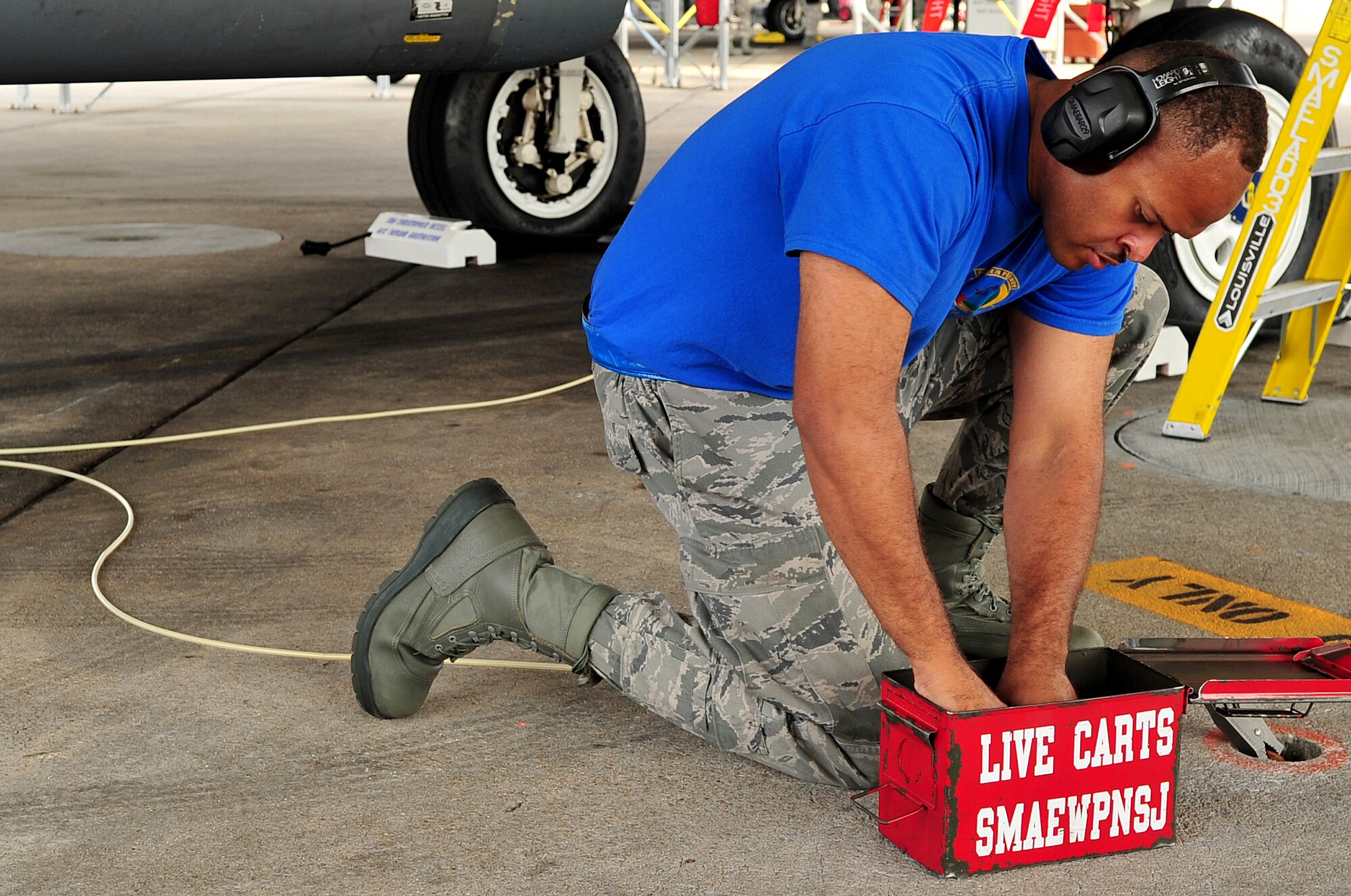 Senior Airman Nadif Llewellyn, 334th Aircraft Maintanence Unit weapons loadcrew member, searches for a tool Aug. 8, 2014, during a loadcrew competition  at Seymour Johnson Air Force Base, North Carolina. The quarterly competition showcases a three-man crew from each aircraft maintanence unit. (U.S. Air Force photo/Airman 1st Class Shawna L. Keyes)