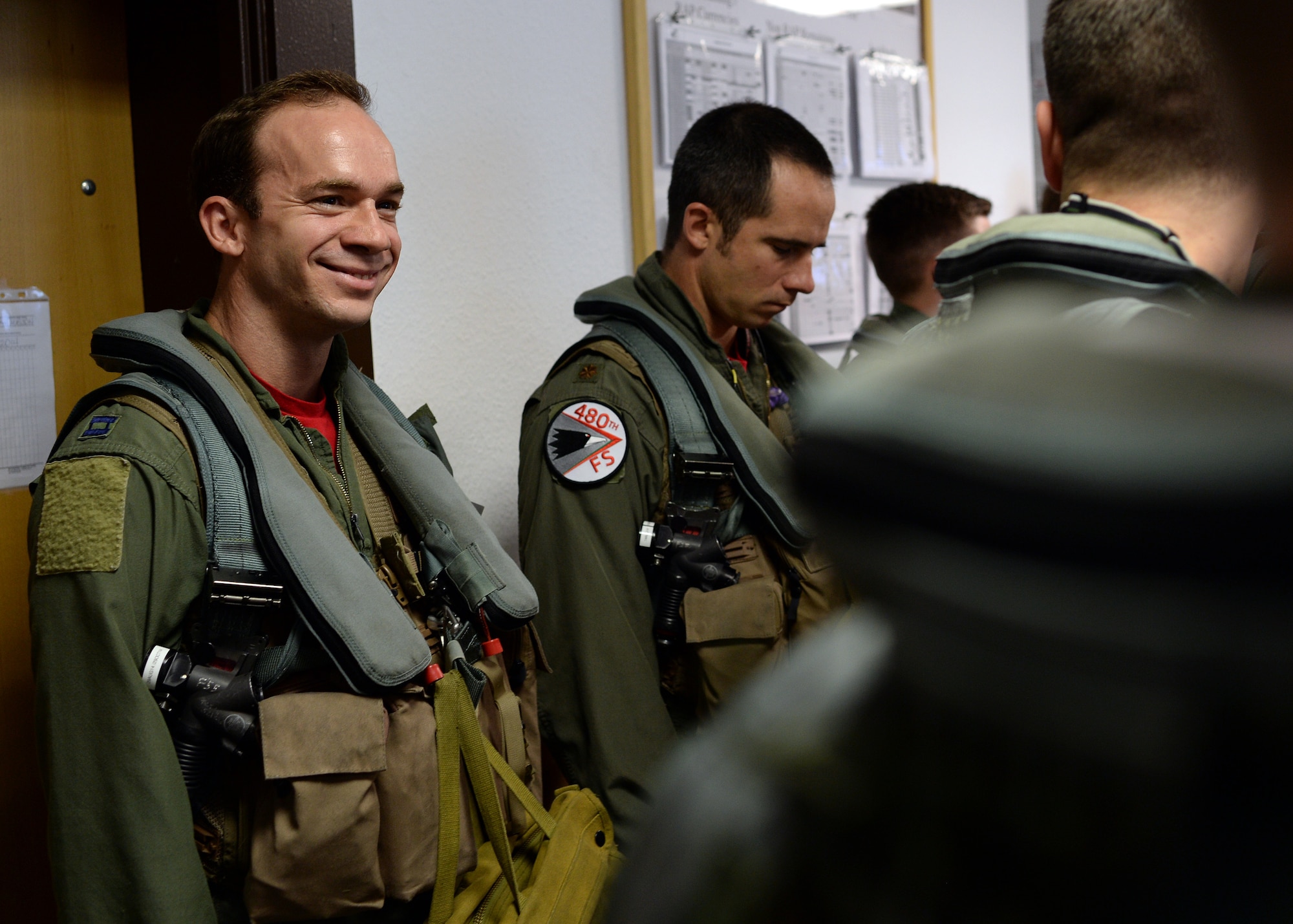 A U.S. Air Force F-16 Fighting Falcon fighter aircraft pilot from Spangdahlem Air Base, Germany, listens to his pre-flight brief Aug. 8, 2014, before flying to Souda Bay, Greece, for a two-week training event with the Hellenic air force. NATO partners and allies train continuously throughout year to ensure their compatibility if called to act in support of regional peace and stability. (U.S. Air Force photo by Staff Sgt. Daryl Knee/Released)