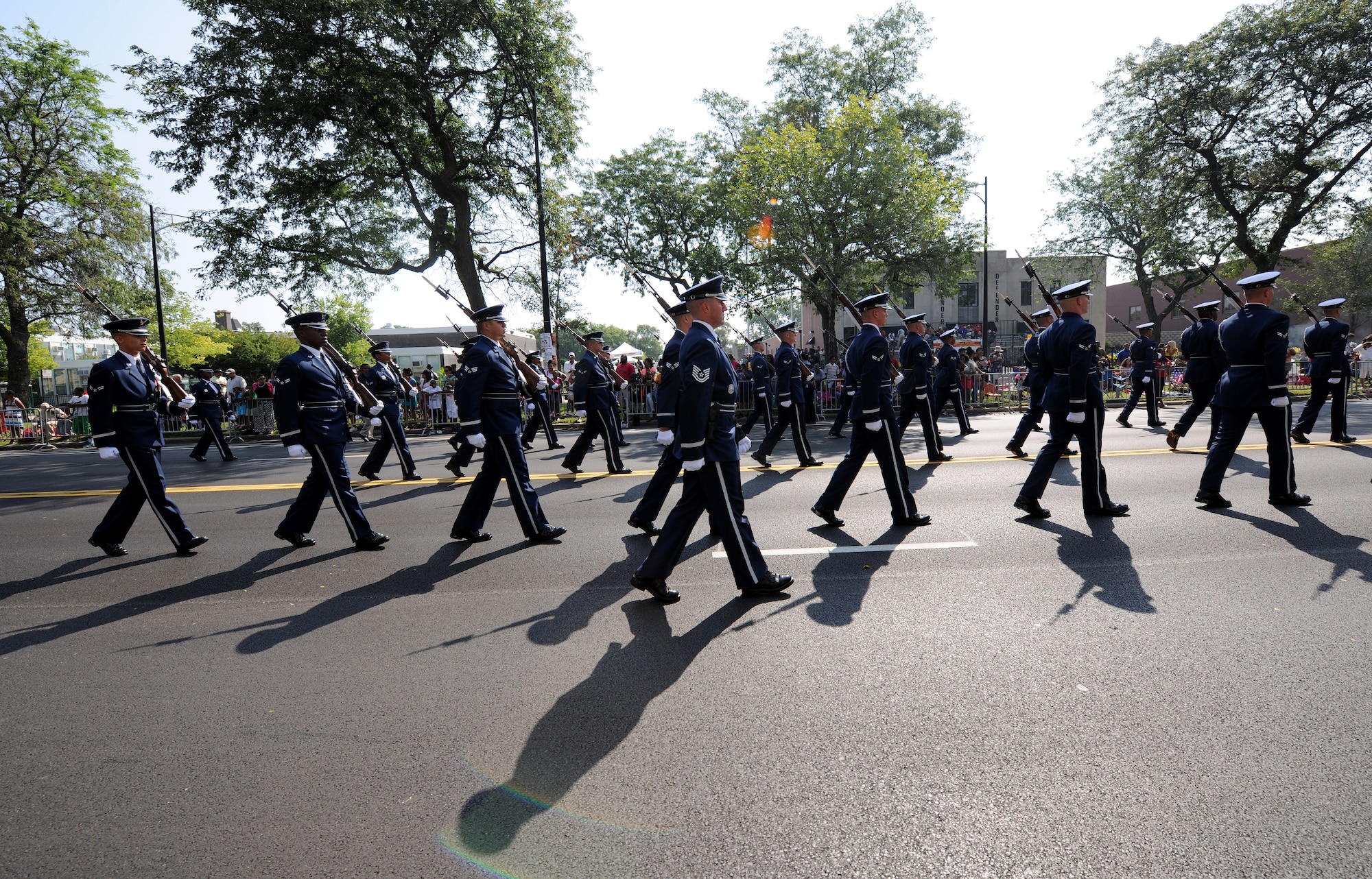 United States Air Force Honor Guard members march in front of approximately 1.5 attendees during the Bud Billiken Parade in Chicago, Il., August 9, 2014.  The parade has been an annual Chicago event since 1929. (U.S. Air Force photo/ Senior Airman Nesha Humes)