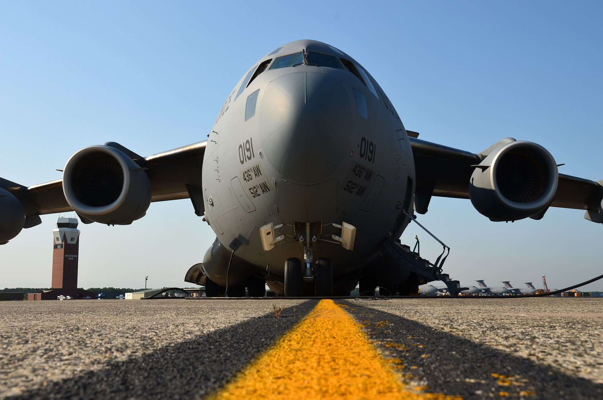 A C-17 Globemaster from the 512th Airlift Wing, Dover AFB, Del., rests on the tarmac just behind the Base Hangar at Westover ARB, Mass, Aug. 11, 2014. The C-17 picked up Airmen from the 439th Aeromedical Evacuation Squadron for routine training aboard the transport aircraft. Currently, aeromedical evacuation is used to transport injured troops from Operation Iraqi Freedom, and Operation Enduring Freedom, as well as to respond to humanitarian missions. (U.S. Air Force photo/SSgt. Kelly Goonan)