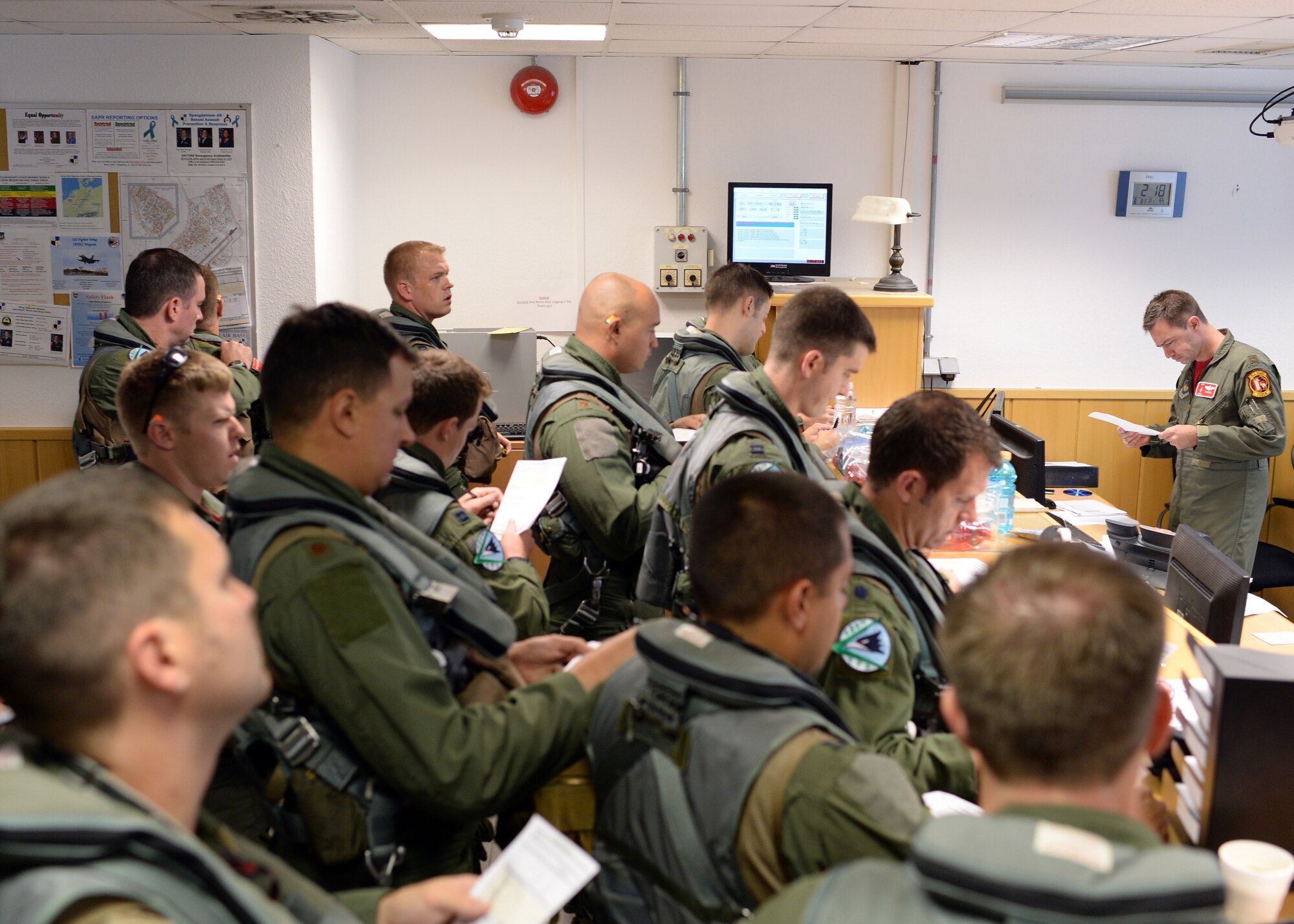 Pilots from the 480th Fighter Squadron at Spangdahlem Air Base, Germany, receive their pre-flight briefing Aug. 8, 2014, before flying to Souda Bay, Greece, for a training event with the Hellenic air force Aug. 11-23. The U.S. Airmen pilot the F-16 Fighting Falcon fighter aircraft and will engage in large-force training event throughout the week with the aircraft inventory of Greece. (U.S. Air Force photo by Staff Sgt. Daryl Knee/Released)