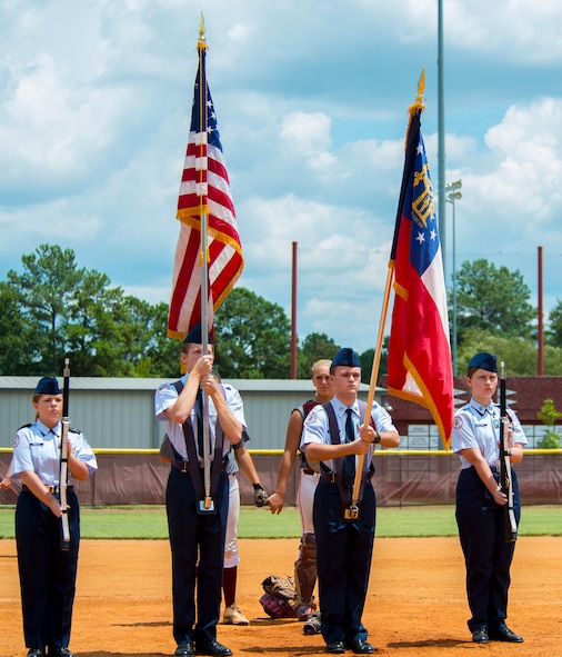 Lowndes High School Air Force Junior Reserve Officer Training Corps’ color guard presents the colors during the Vikettes softball game at Morris-Coats Field of Dreams, Valdosta, Ga., Aug. 9, 2014. LHS Vikettes went on to beat the Camden High School Wildcats 11-3. (U.S. Air Force photo by Airman 1st Class Ceaira Tinsley/Released)