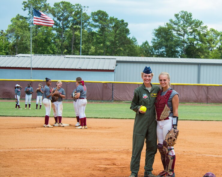 U.S. Air Force Col. Andra Kniep, 23d Wing vice commander, left, and Becca Prairie, Lowndes High School Vikettes softball catcher, pose for a photo at Morris-Coats Field of Dreams, Valdosta, Ga.,  Aug. 9, 2014. The Vikettes hosted Military Appreciation Day and allowed Kneip to throw the first pitch to start the game. (U.S. Air Force photo by Airman 1st Class Ceaira Tinsley/Released)