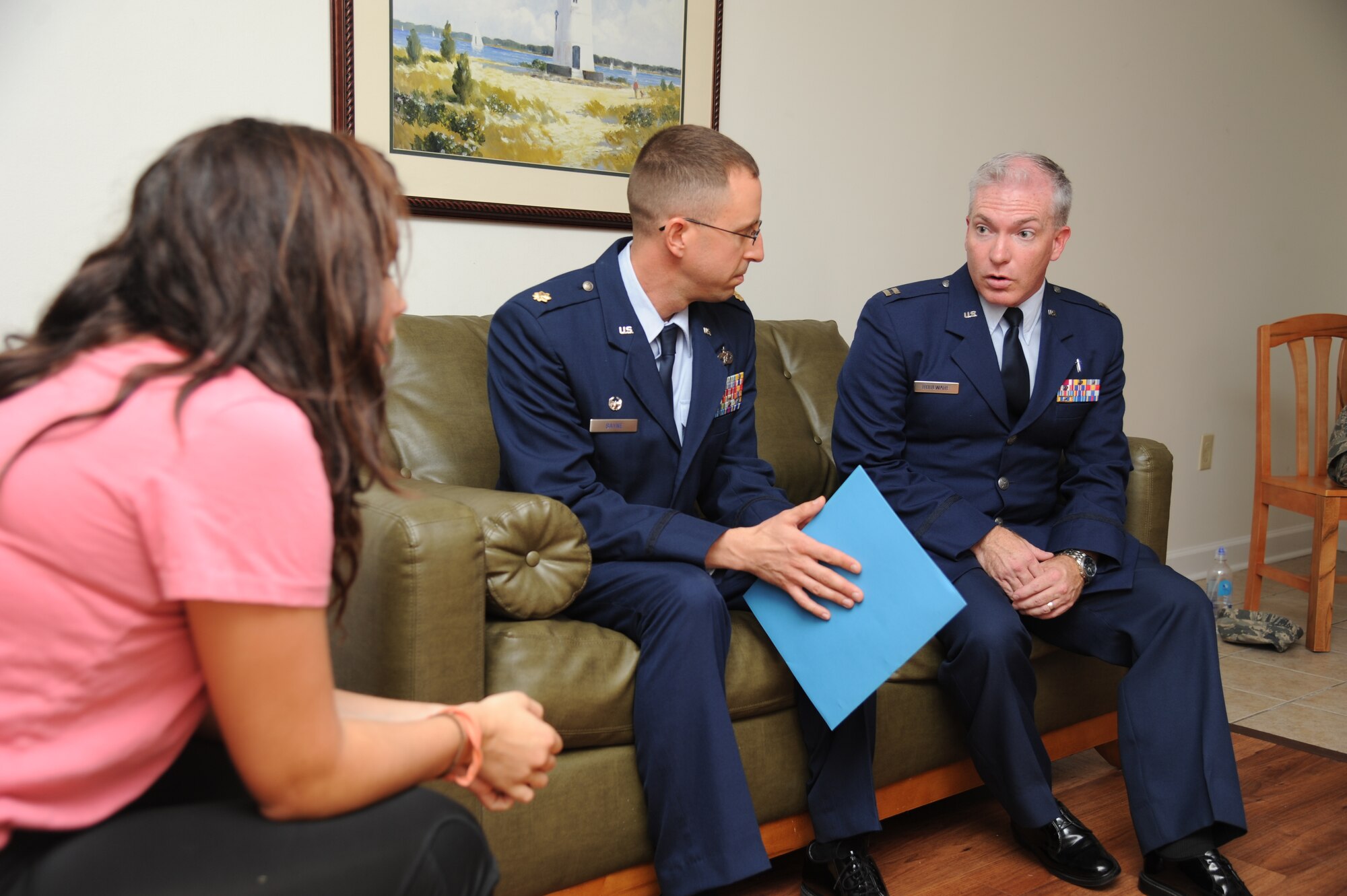 Chaplain (Capt.) John Boulware, 81st Training Wing, (far right), and Maj. Clifford Bayne, 81st Logistics Readiness Squadron commander, deliver a next of kin notification to exercise “role player,” Airman 1st Class Abigail Skaggs, 81st Dental Squadron, during a major accident response exercise Aug. 7, 2014, at the Locker House at Keesler Air Force Base, Miss. Team Keesler practiced real-world training during the exercise which simulated a gas line explosion that set a building on fire.  (U.S. Air Force photo by Kemberly Groue)