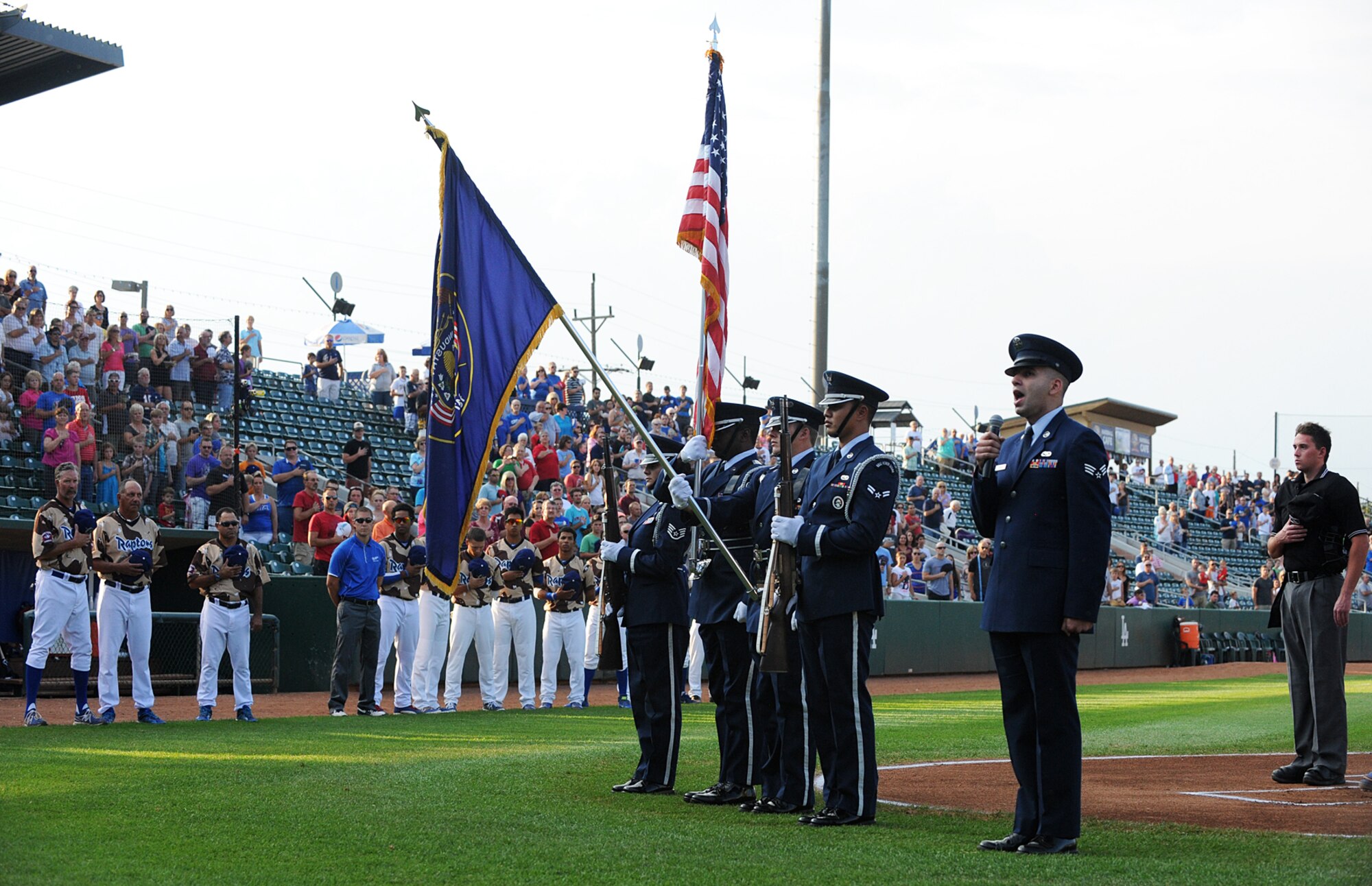 Airmen from Hill Air Force Base presented the flag and sang the nation anthem Friday during the Ogden Raptors' Military Appreciation Night game. (U.S. Air Force photo by Alex R. Lloyd)