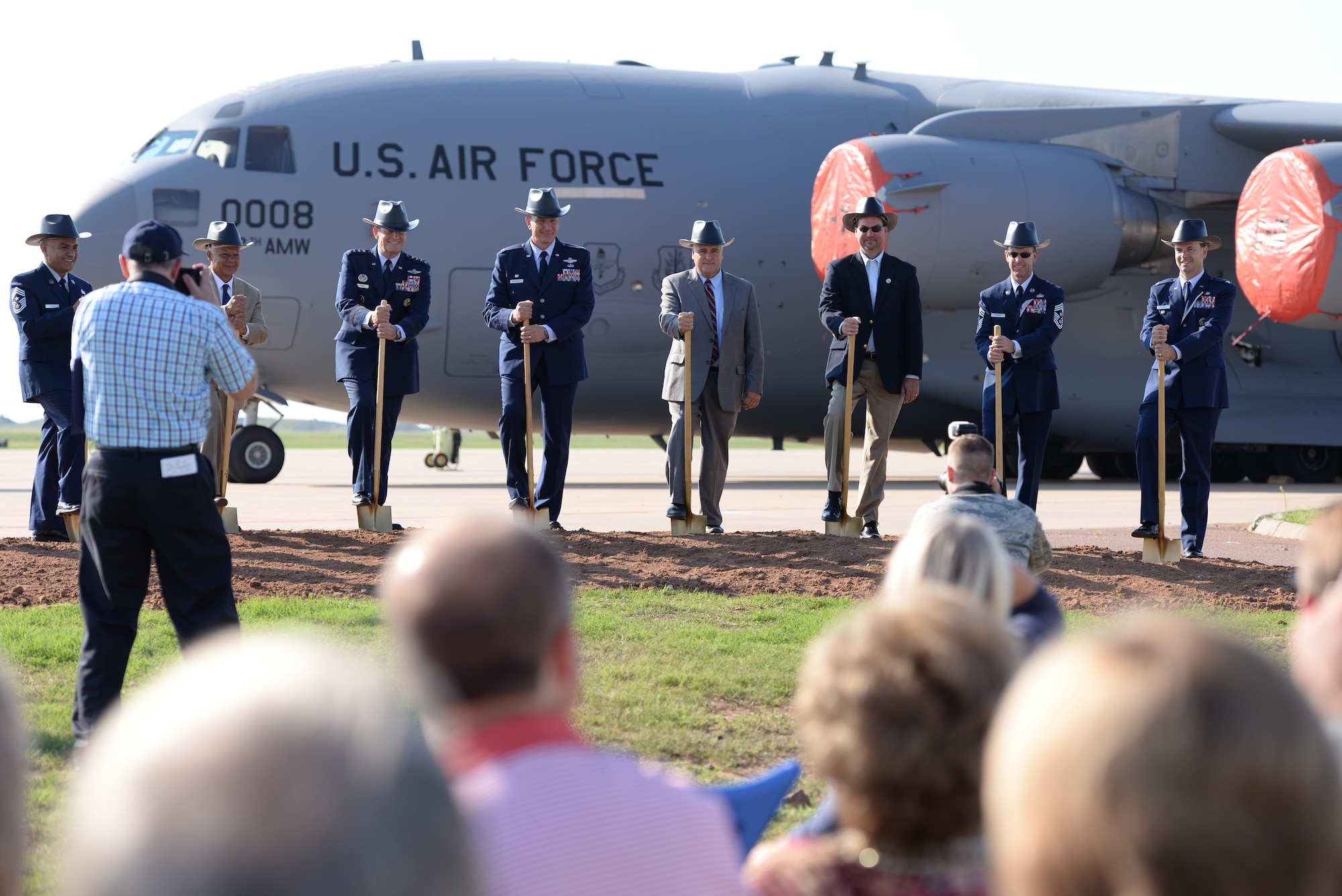 ALTUS AIR FORCE BASE, Okla. – Members of the official party, including the commander of Air Education and Training Command Gen. Robin Rand and 97th Air Mobility Wing Commander Col. Bill Spangenthal, break ground for new KC-46 Pegasus construction projects during a ceremony Aug. 7, 2014. In Southwest Oklahoma fashion, the group wore cowboy construction hats for the dig. The new construction is estimated at $56 million and will include a flight training center, a fuselage training facility, new aircraft hangars and renovations for a combined squadron operations and aircraft maintenance unit facility. (U.S. Air Force photo by Staff Sgt. Nathanael Callon/Released)