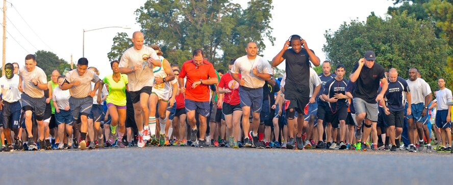 Runners begin the Superhero 5K Fun Run on Barksdale Air Force Base, La., Aug. 8, 2014. Participants dressed up as their favorite superheroes to include Batman, Superman, Iron Man and others. (U.S. Air Force photo/Airman 1st Class Benjamin Raughton)