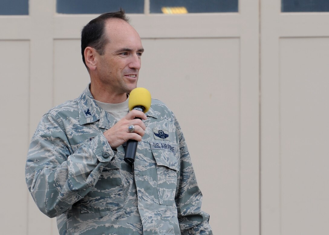Col. Kevin Kennedy, 28th Bomb Wing commander, addresses 2014 Dakota Thunder Motorcycle Run participants on the flightline at Ellsworth Air Force Base, S.D., Aug. 5, 2014. Kennedy highlighted the role the event plays in honoring military members and veterans while also emphasizing the importance of safety during the ride. (U.S. Air Force photo by Senior Airman Anania Tekurio/Released)