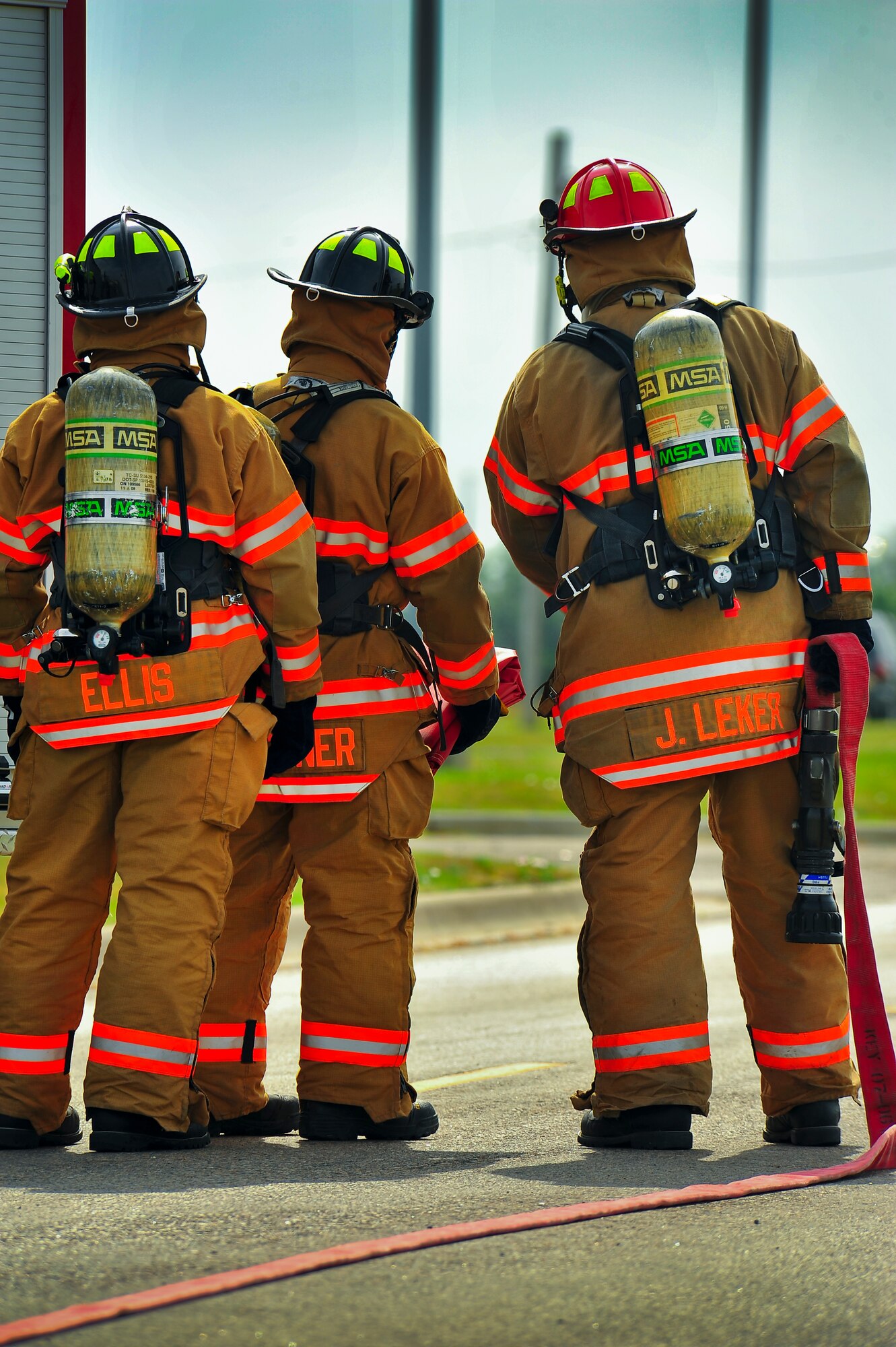 Fire fighters from the 5th Civil Engineer Squadron participate in an exercise on Minot Air Force Base, N.D., Aug. 5, 2014. The exercise focused on the base’s ability to respond, survive and operate in a chemical, biological, radiological or nuclear contaminated environment. (U.S. Air Force photo/Senior Airman Brittany Y. Bateman)