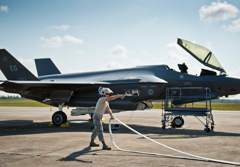 An Eglin Air Force Base firefighter begins to secure equipment after a joint-base major accident response exercise between Eglin Air Force Base and Duke Field, Fla., Aug. 6.  The simulated accident was a mid-air collision of a 33rd Fighter Wing joint strike fighter and a 919th Special Operations Wing C-145.  First responders had to react to both accidents simultaneously, secure the scene, put out fires and help the wounded.  (U.S. Air Force photo/Tech. Sgt. Samuel King Jr.)