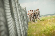 Airmen wait inside launch facility B-2 during a code change in the missile complex, N.D., July 30, 2014. All three 91st Missile Wing Groups work together to complete the code change in order to ensure the security of our nation’s assets. (U.S. Air Force photo/Airman 1st Class Apryl Hall)