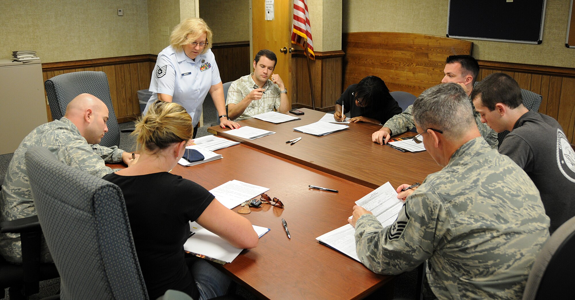 U.S. Air Force Technical Sgt. Sherry Marotta, 192nd Fighter Wing Military Pay Technician explains the military pay system and requirements to the newest members of the 192nd Fighter Wing at the financial brief for new gains briefing.  The 192nd Comptroller Flight sponsors the monthly financial briefing to ensure new Virginia Air Guard members have an understanding of how the finance office functions and what paperwork is required from each of them in order to get their drill pay started. All prior service and new Air Guard members are required to attend this briefing. (U.S. Air National Guard photo by Capt. Craig Carper/Released)