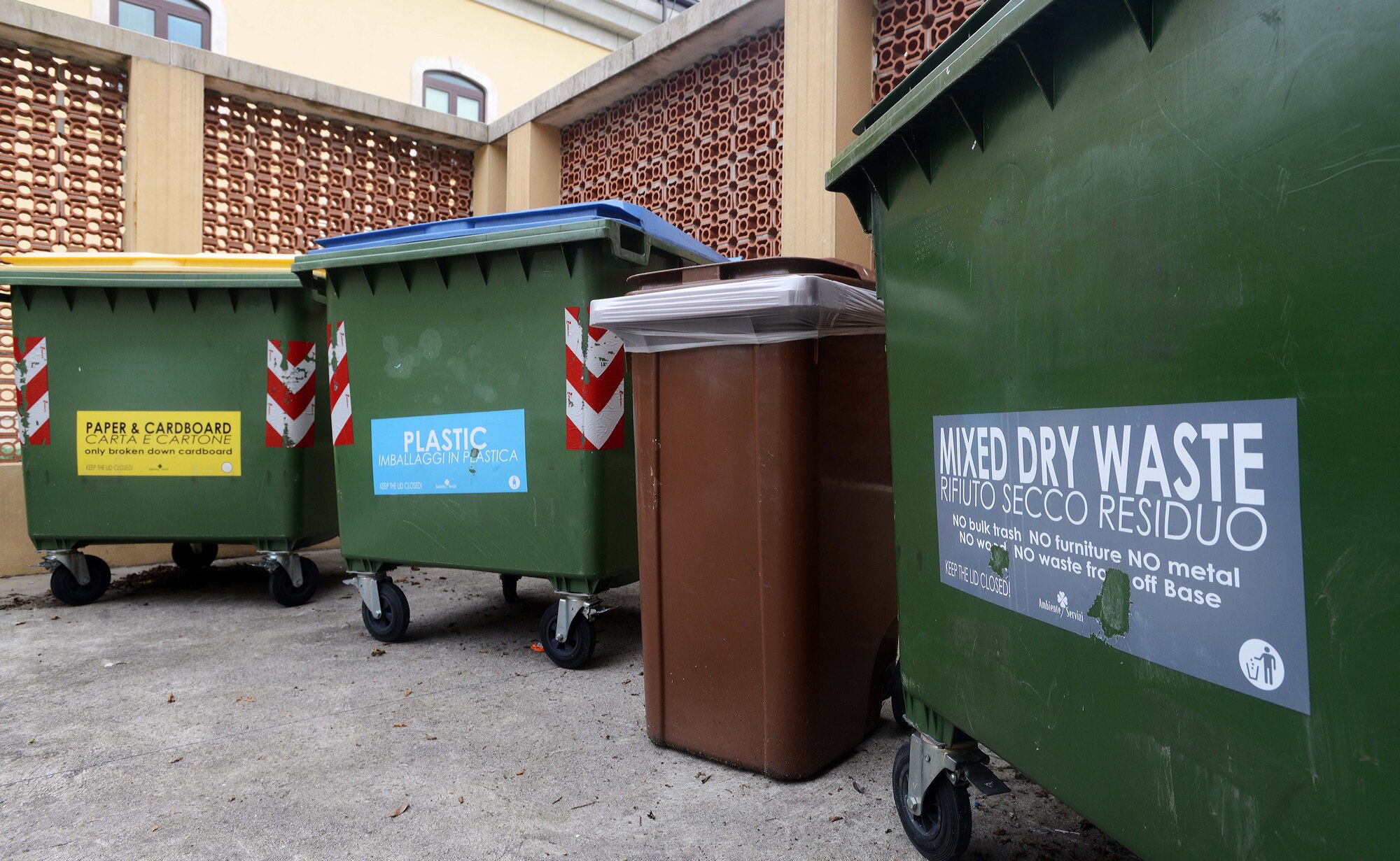 Communities and on-base trash bins are labeled for Team Aviano members to easily remember correct recycling procedures. Recycling is required by Italian law and improper waste disposal and recycling can lead to additional government charges or potential fines for service members. (U.S. Air Force photo/Airman 1st Class Deana Heitzman)