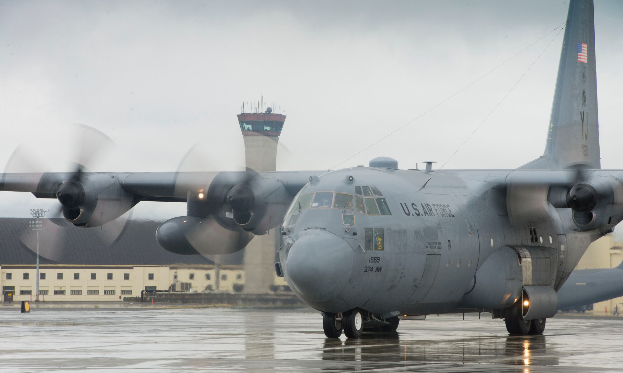 A C-130 Hercules from the 36th Airlift Squadron waits for approval from the air traffic control tower prior to taking off during an off-site training sortie Aug. 5, 2014, Joint Base Elmendorf-Richardson, Alaska. The training prepared aircrew personnel for the upcoming Red Flag Exercise. (U.S. Air Force photo by Staff Sgt. Chad C. Strohmeyer/Released)
