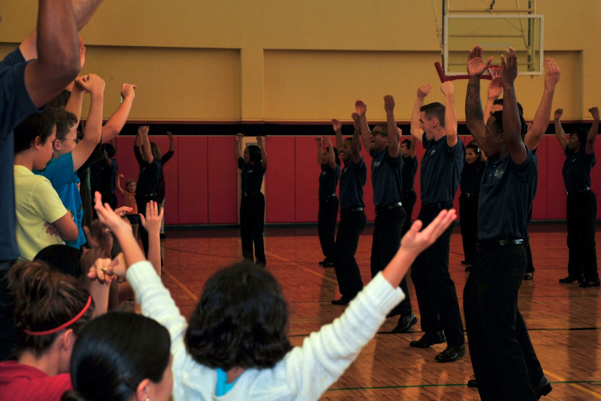 Tops In Blue members sing “Y.M.C.A.” during a performance at the Youth Center on Andersen Air Force Base, Guam, Aug. 7, 2014. Tops in Blue, the Air Force’s premier entertainment showcase, tours Air Force installations around the world to perform for Airmen and their families. (U.S. Air Force photo by Staff Sgt. Melissa B. White/Released)