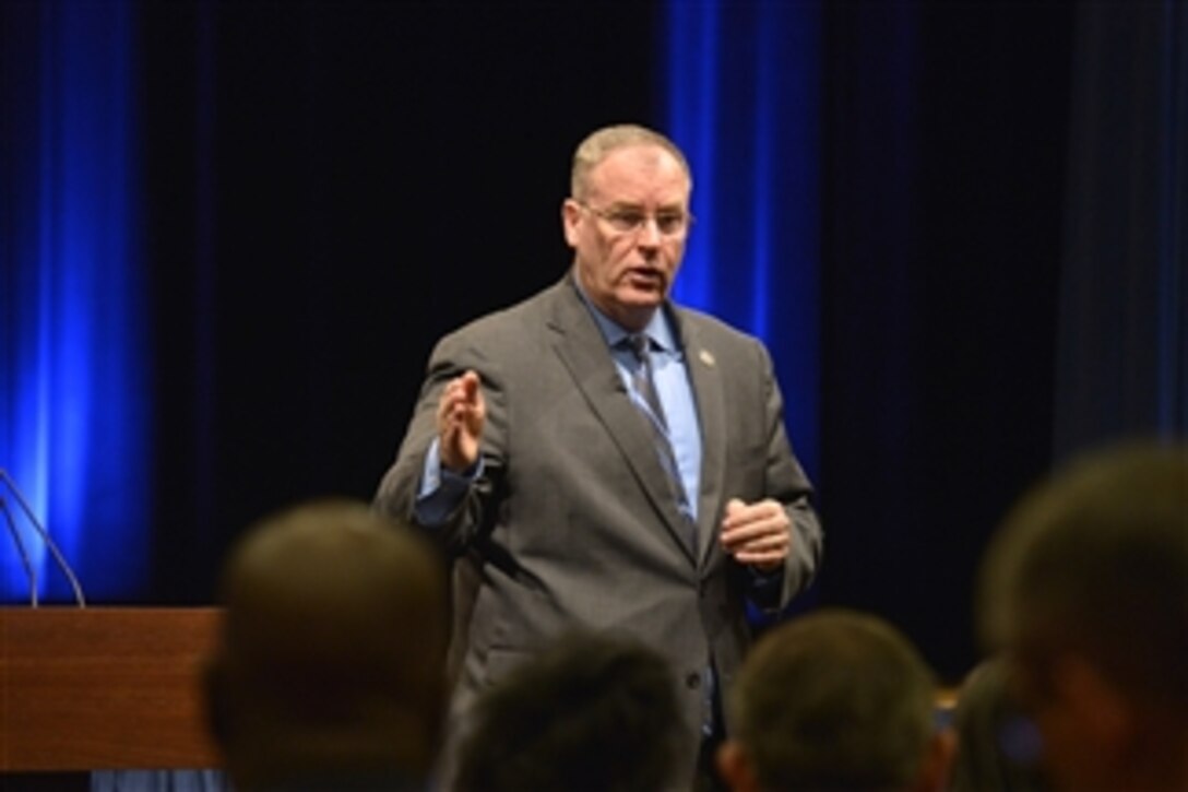 Deputy Defense Secretary Bob Work addresses an all-hands meeting of Defense Department's senior executive service managers at the Pentagon, Aug. 11, 2014. Work discussed the department's budgetary realities and personally thanked members of the senior executive workforce with 40 or more years of service.