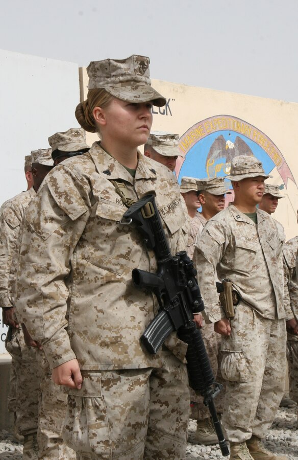 Corporal Andrea M. Robb, the Theater Provided Equipment clerk with Marine Expeditionary Brigade - Afghanistan, stands in formation during her meritorious promotion to sergeant aboard Camp Leatherneck, Helmand province, Afghanistan, Aug. 2, 2014. Robb is responsible for a $28 million account, and oversees approximately 8,500 pieces of equipment needing to be retrograded back to the States. This is Robb’s third meritorious promotion since joining the Marine Corps approximately three years ago.