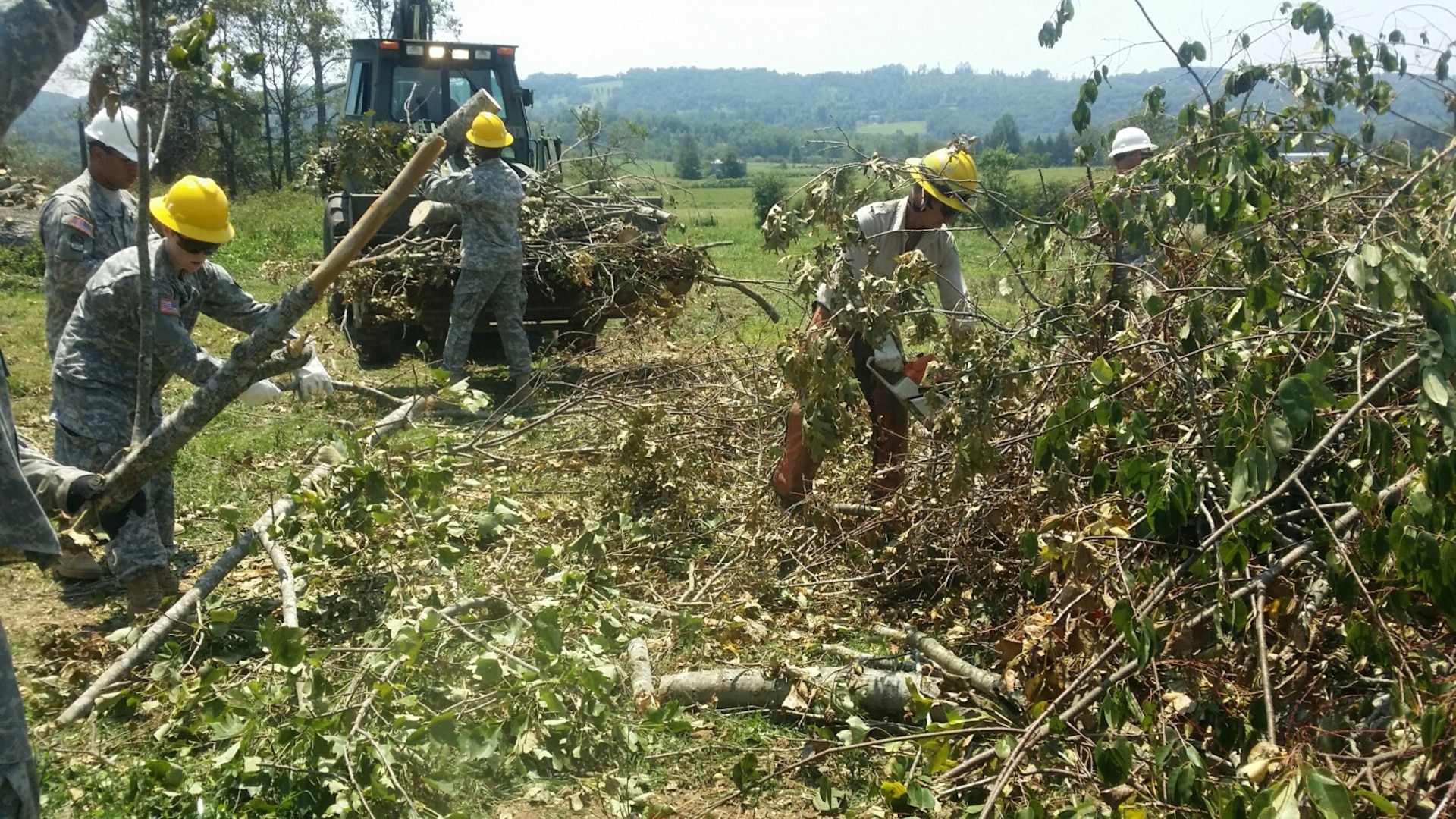 Tennessee National Guard Soldiers worked closely with the Tennessee Department of Forestry to clear brush from the Claiborne County, Tenn., tornado of July 27, 2014.