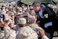 Robin Williams with troops gathered at the Camp Liberty Post Exchange in Baghdad during a USO tour, Dec. 14, 2004. DoD file photo by U.S. Army Sgt. Dan Purcell)   