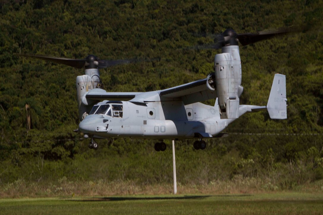 An MV-22 Osprey with Marine Operational Test and Evaluation Squadron 22 (VMX-22) departs from Marambaia Island, Brazil, after tactically inserting Marines and Sailors with Special Purpose Marine Air Ground Task Force South, Aug. 4, 2014. The SPMAGTF personnel came to the island to participate in a theater security cooperation event with Brazilian Naval forces. The TSC event was made up of multiple bi-lateral exchanges to include medical treatment, improvised explosive device detection, combat tracking and combat marksmanship. Through close cooperation, the U.S. and its partners are ready to address transnational security challenges through integrated and coordinated approaches. SPMAGTF-South is currently embarked aboard the future amphibious assault ship USS America (LHA 6) in support of her maiden transit, "America Visits the Americas." (U.S. Marine Corps Photo by Cpl. Donald Holbert/ Released)