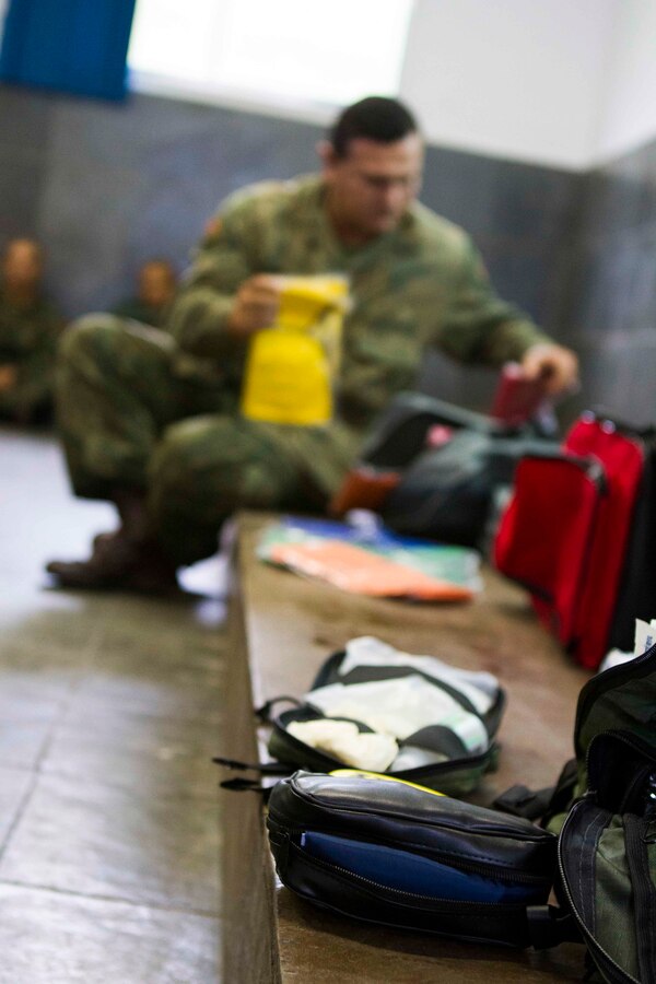 Medical supplies are put on display for a mass casualty course during a medical bi-lateral exchange with Brazilian Naval forces at Marambaia Island, Brazil, August 5, 2014. The exchange was held as part of a theater security cooperation event with the Logistics Combat Element of Special Purpose Marine Air Ground Task Force South. Through close cooperation, the U.S. and its partners are ready to address transnational security challenges through integrated and coordinated approaches. SPMAGTF-South is currently embarked aboard the future amphibious assault ship USS America (LHA 6) in support of her maiden transit, "America Visits the Americas." (U.S. Marine Corps Photo by Cpl. Donald Holbert/ Released)